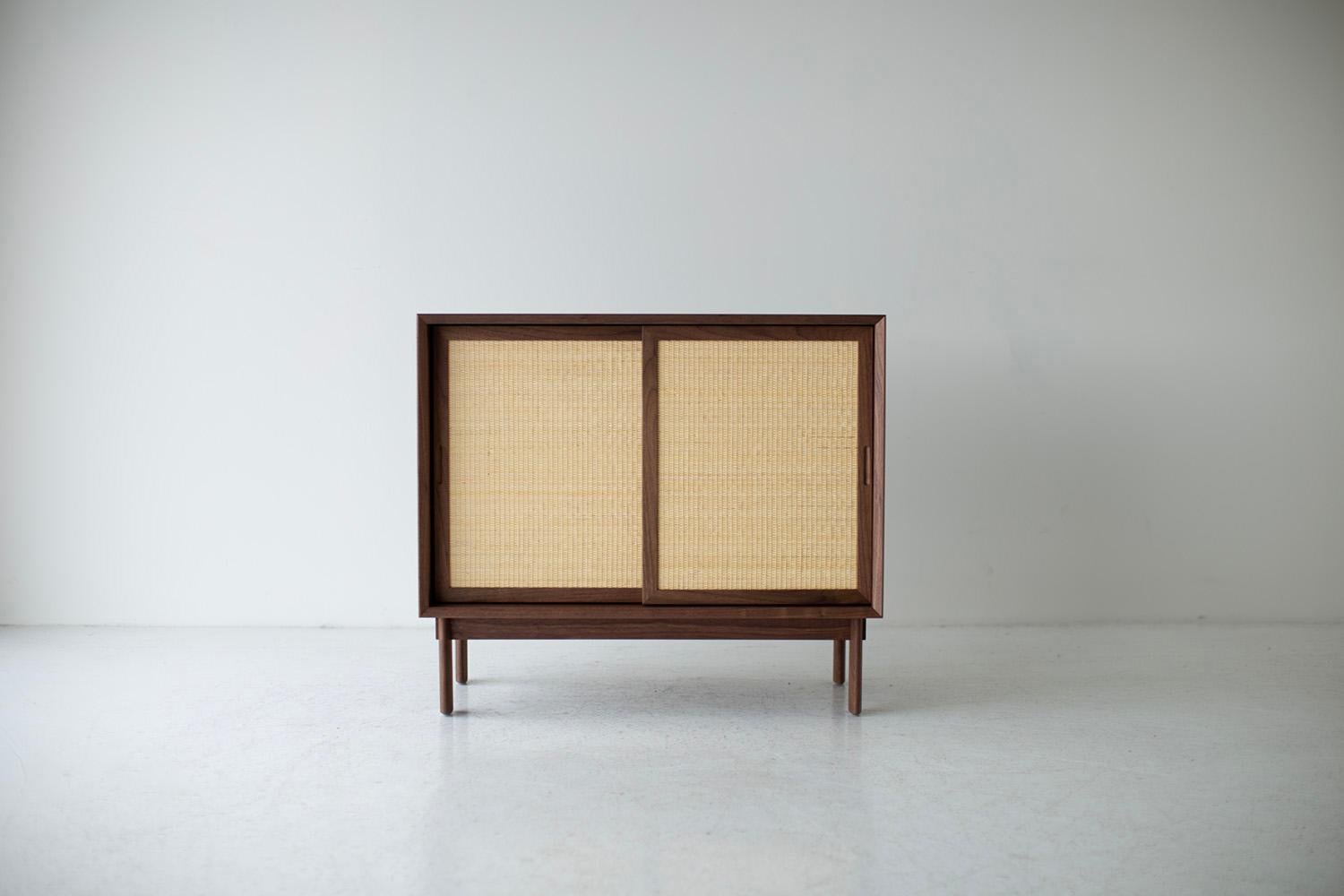 Peabody Cane Front Credenza, Modern Walnut Credenza, cane front, walnut, CraftAssociates Furniture

This Lawrence Peabody modern cane front credenza in walnut for Craft Associates Furniture is expertly hand crafted. The Peabody collection pieces