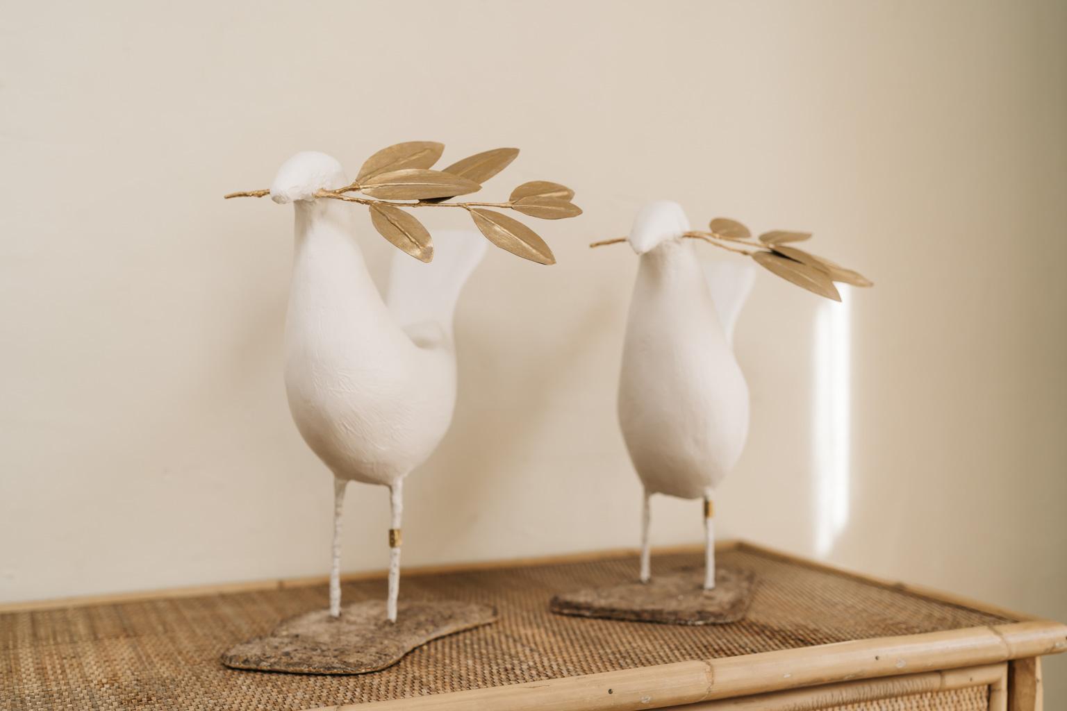 peace birds, poetic art by French artist José Esteves. Each one is unique,
Measures: one is 37 cm high x 35 cm long and 26 cm deep, the other one is 
35 cm high x 36 cm long and 26 cm deep.