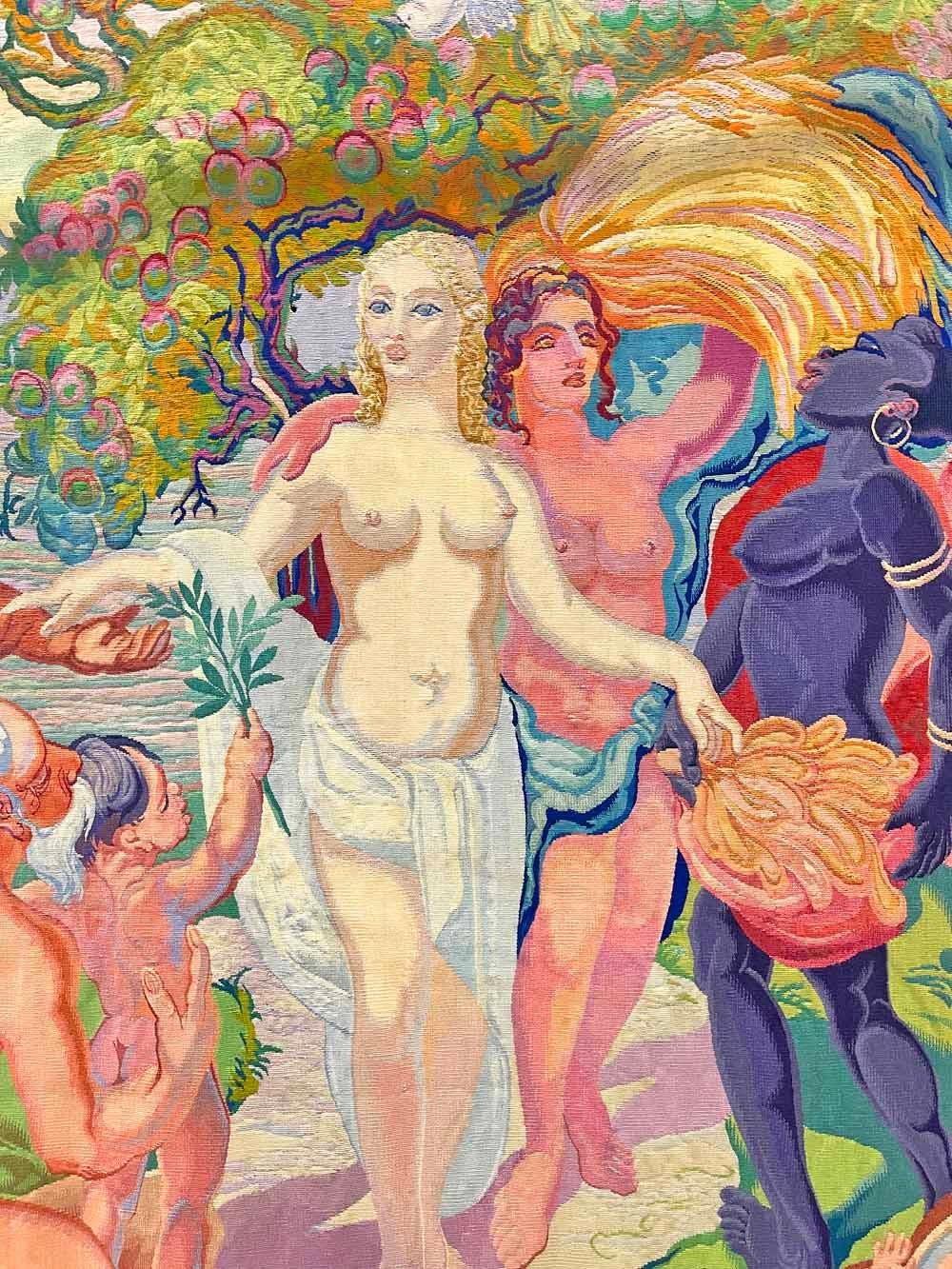 A unique and remarkable work of art with great historical importance, this monumental Art Deco tapestry celebrating the end of World War II presents a large scene of nude male and female figures in brilliant colors symbolizing rebirth and abundance.