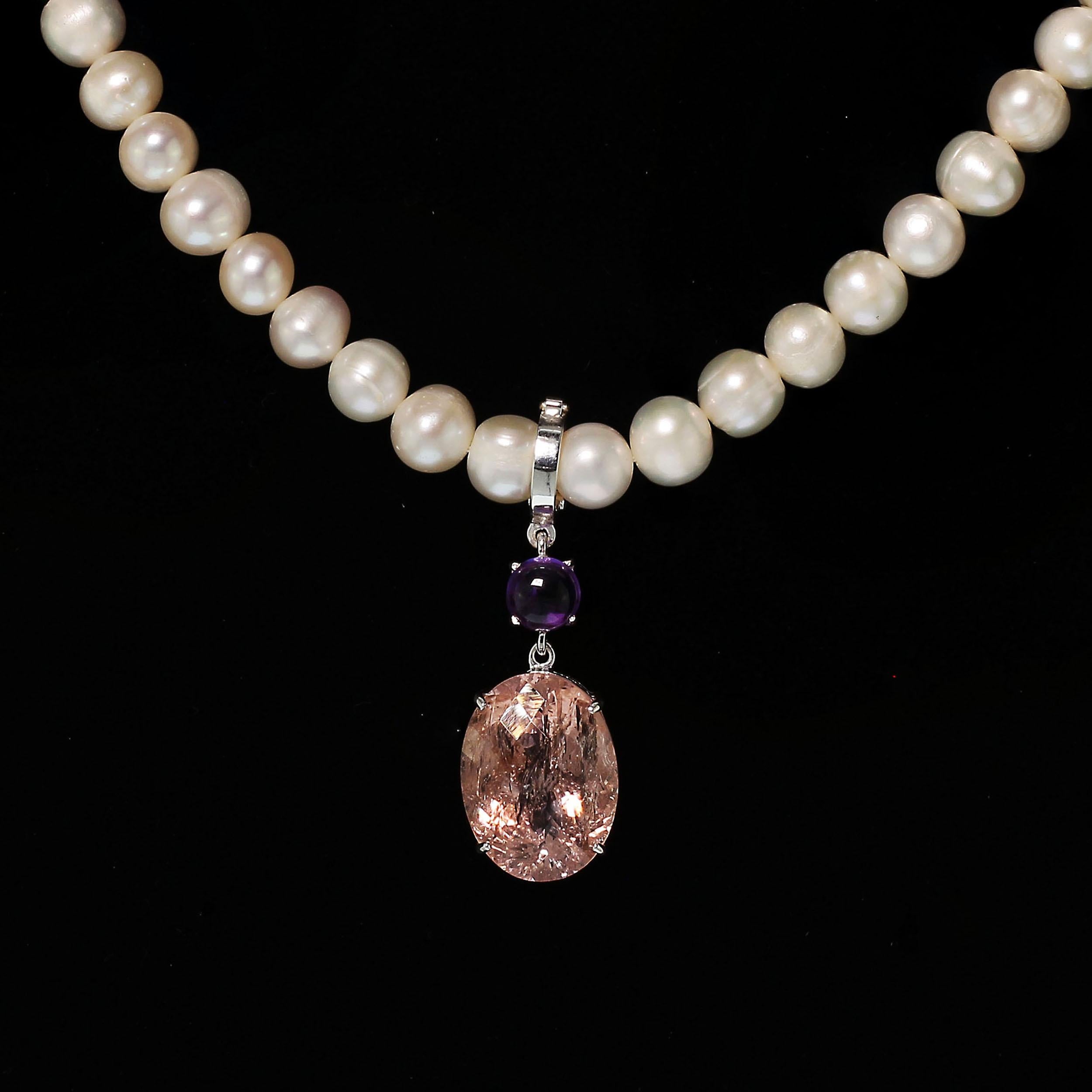 Pendant of oval Morganite ﻿with checkerboard table sparkles and pops with all the typical beryl inclusions swinging from a round glowing Amethyst. This hinged Sterling Silver bail works perfectly over your favorite pearls, chains, or other