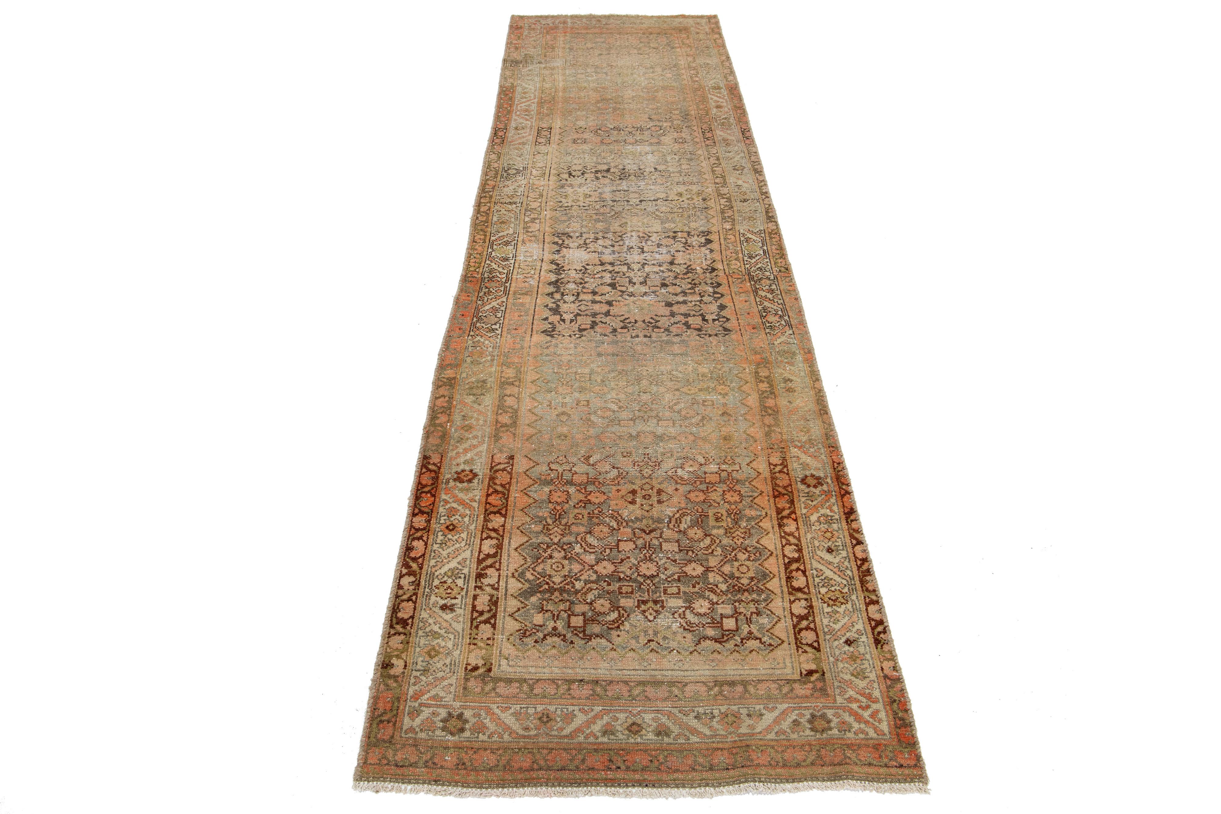 This is a handmade Persian Malayer wool runner from the 20th century. The design features a peach field with brown, yellow, and gray accents.

This rug measures 3' X 11'10