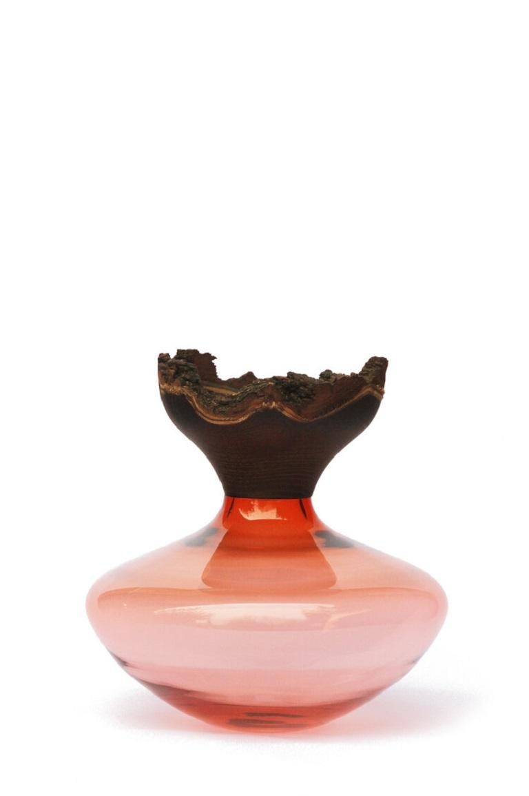 Peach Bloom stacking vessel, Pia Wüstenberg
Dimensions: D 26 x H 26
Materials: glass, wood
Available in other colors.

Characterised by its refine and delicate smoked Acacia bowl, which mirrors the curves of the glass part in a seamless