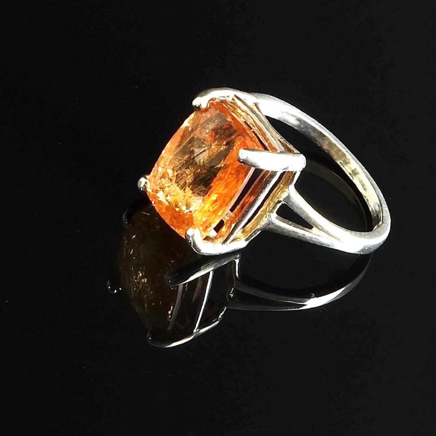 This custom made ring is a delight for your eyes. Sterling Silver Ring holds a sparkling Peach Color Retangular cushion  Imperial Topaz with Checkerboard table. This unique sparkling Imperial Topaz comes straight from Ouro Preto, Minas Gerais,