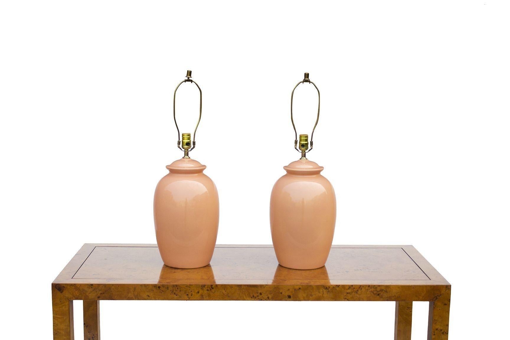 USA, 1980s
Peach Ginger Jar Ceramic Table Lamps. Nice '80s pop of color in a classic profile.
CONDITION NOTES: No chips; original wiring is in working condition.
DIMENSIONS: 9