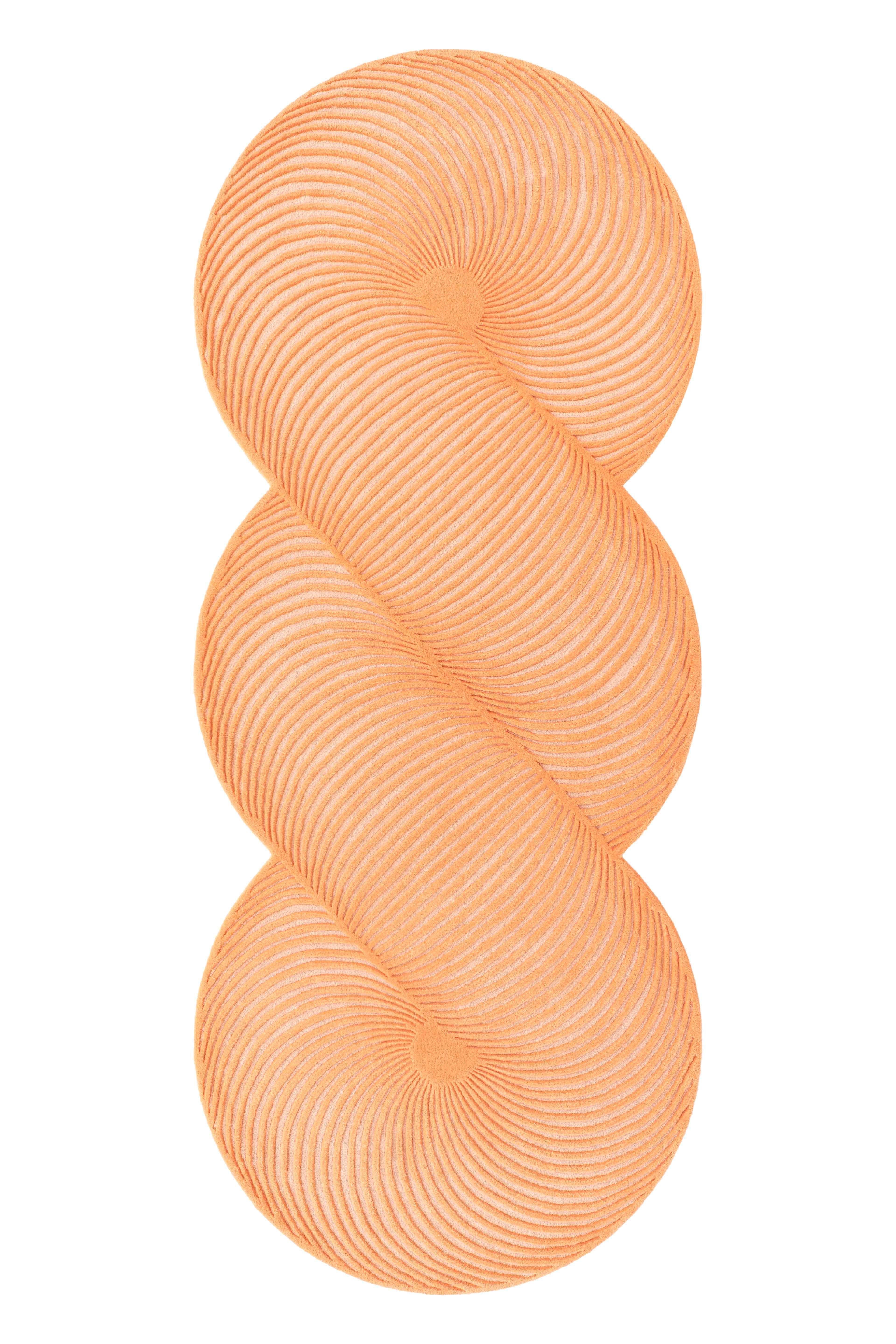Peach Giro Rug by Gandia Blasco
Design by MUT Design
Dimensions: W 132 x H 324 cm. 
Materials: 100% wool.
Weight: 18,5 kg

Passion for life outdoors, a dream come true on the edge of a cliff in the north of Ibiza. The elemental and architectural