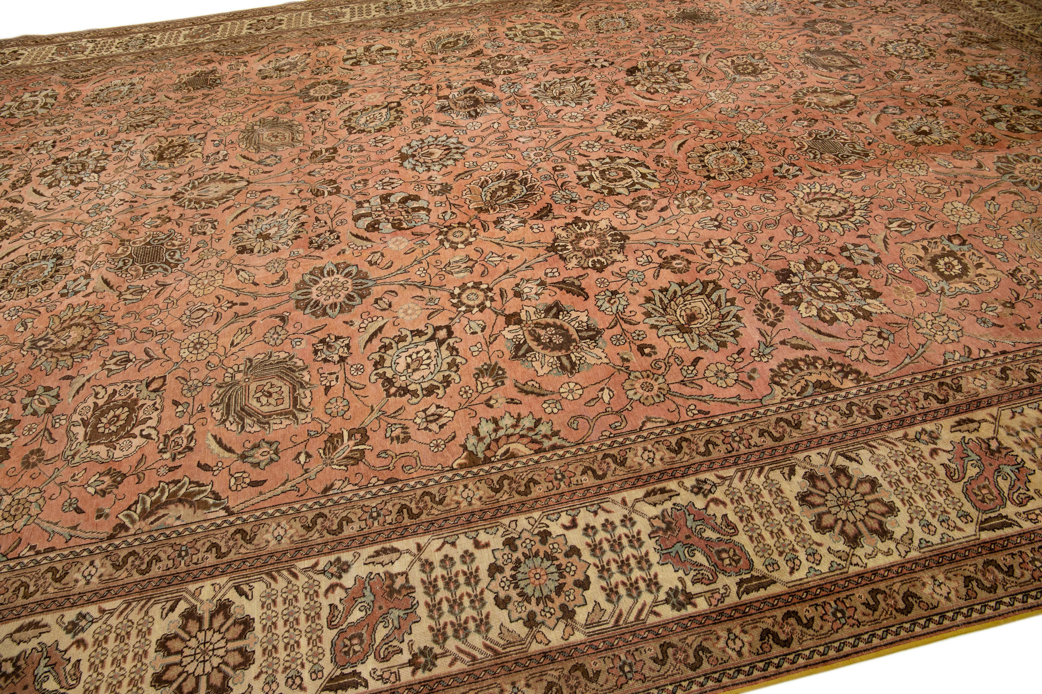 Hand-Knotted Peach Handmade Antique Persian Tabriz Wool Rug with Floral Motif For Sale