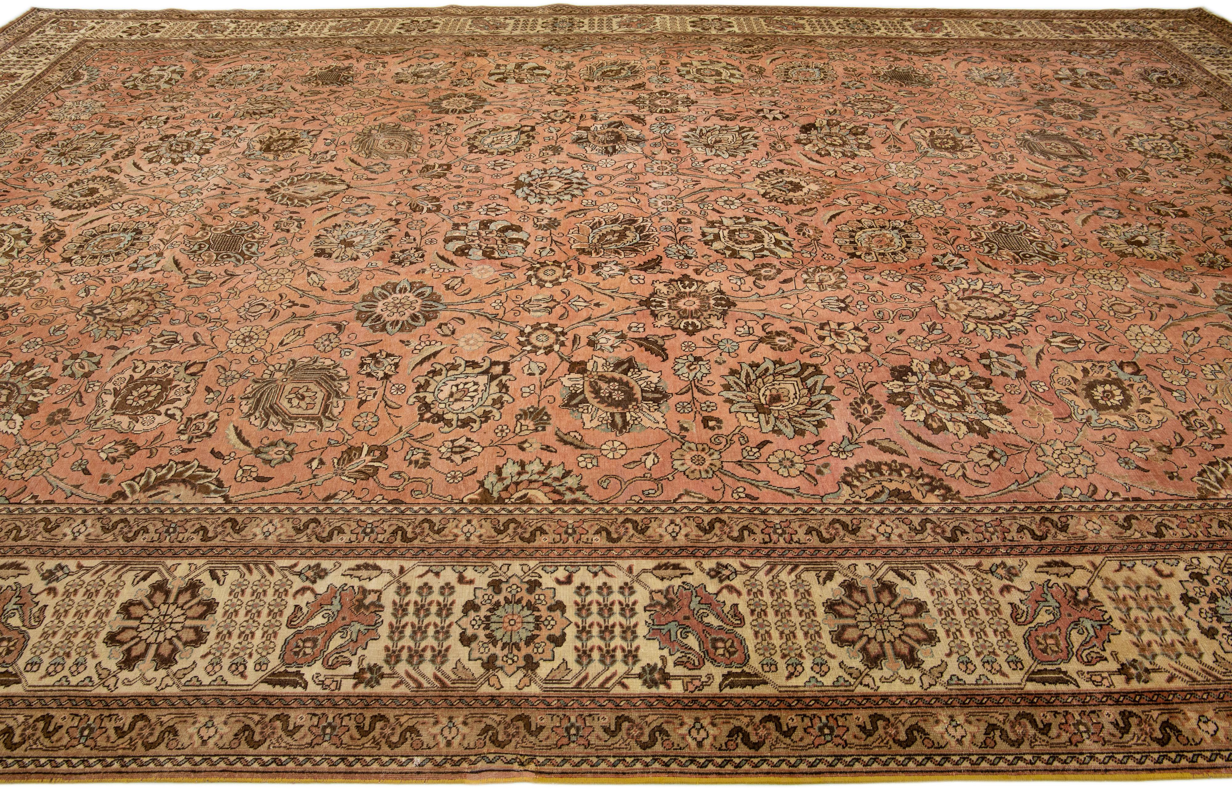 Peach Handmade Antique Persian Tabriz Wool Rug with Floral Motif In Excellent Condition For Sale In Norwalk, CT