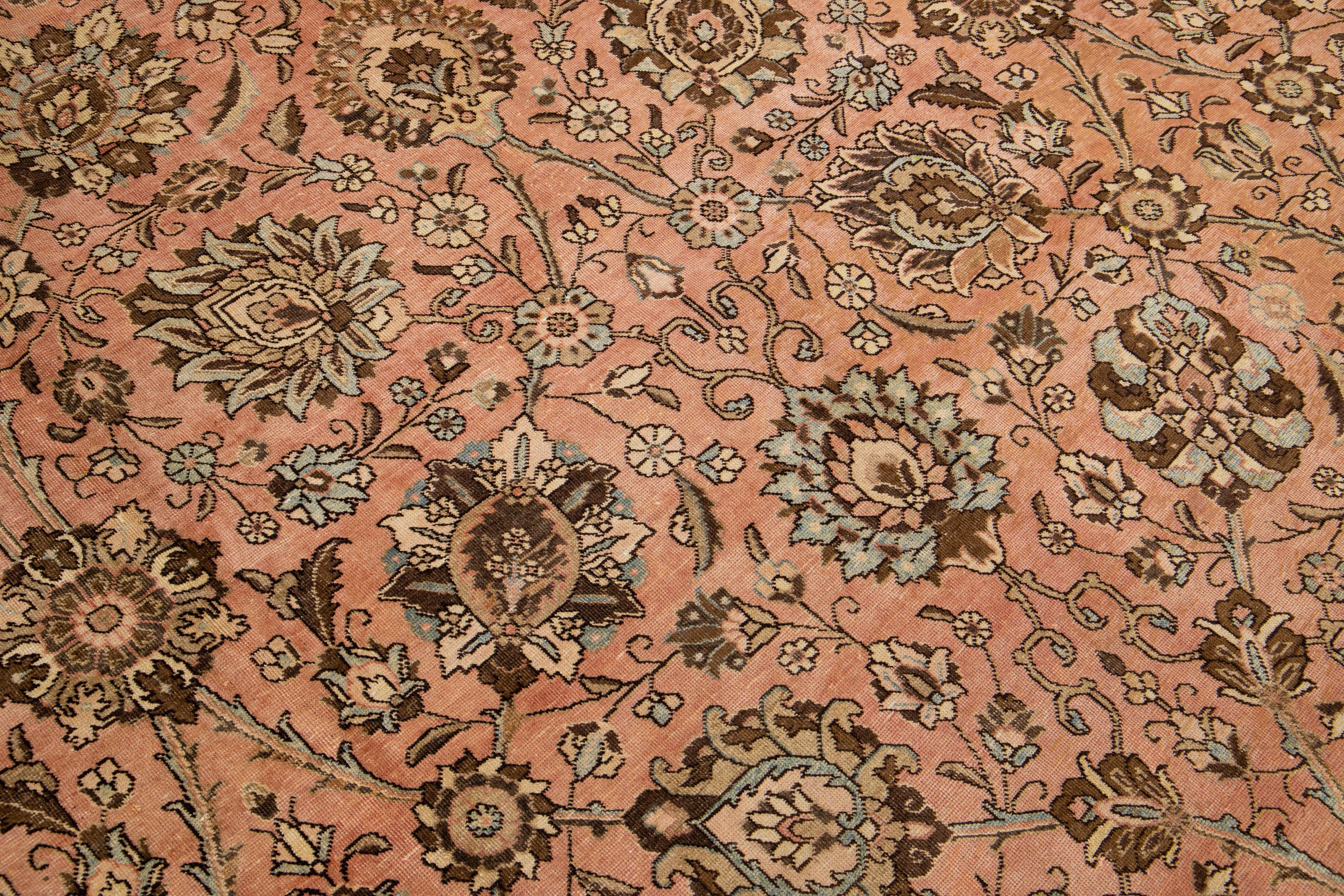 Peach Handmade Antique Persian Tabriz Wool Rug with Floral Motif For Sale 1
