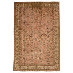 Tapis persan ancien en laine de Tabriz de couleur pêche, fait à la main avec motif floral