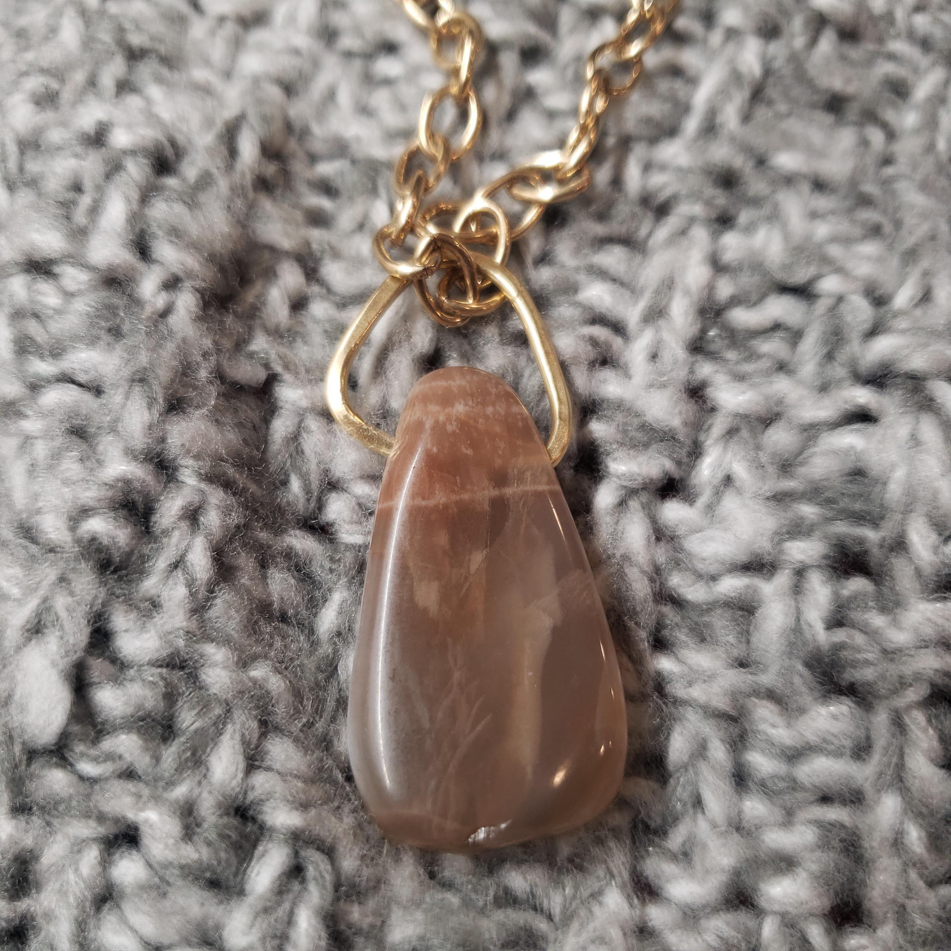 Peach moonstone pendant on genuine brass chain. Peach moonstone is known for bringing harmony to the sacral chakra by providing the wearer with emotional stability and boosting creativity. This piece is a part of the my Chakra Love™ Collection.