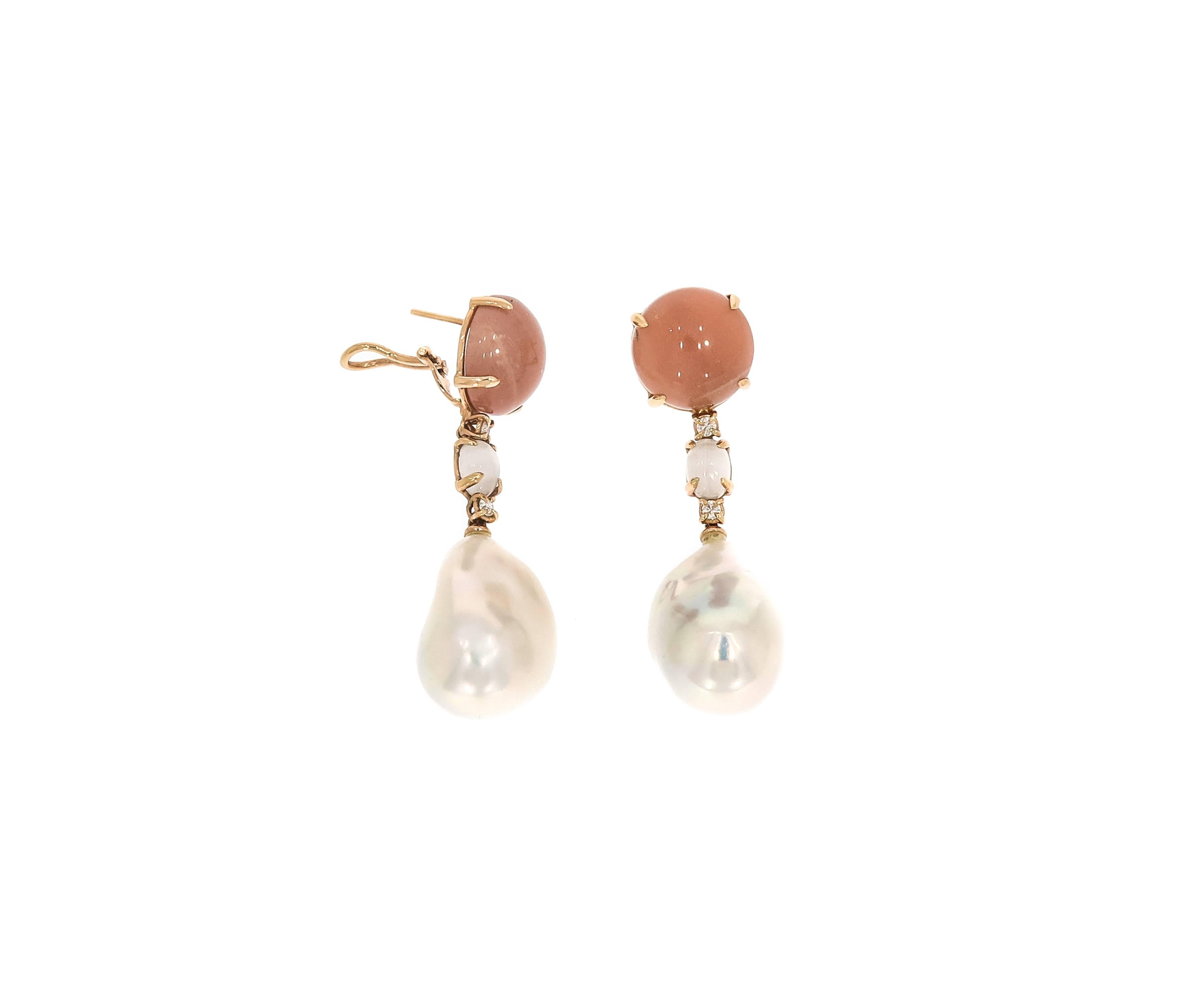 A Soft pastel look is achieved with this peach moonstone mixed with a soft white oval shaped moonstone, adding some diamond sparkles and complimenting below hangs beautifully a gorgeous pure white baroque pearl. 
This peach moonstone and pearl