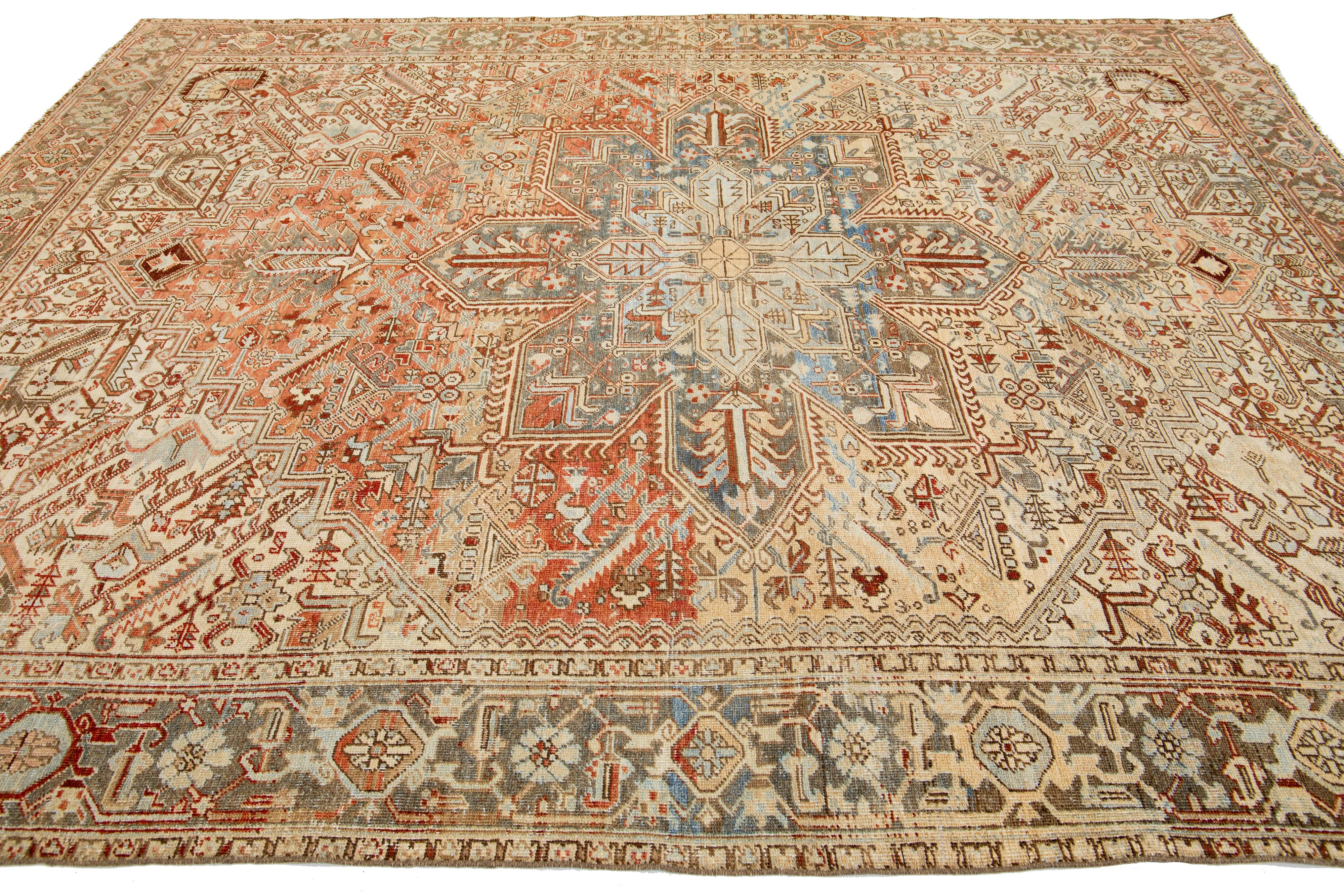 Early 20th Century Peach Persian Heriz Antique Wool Rug Featuring a Medallion Motif From The 1920s For Sale
