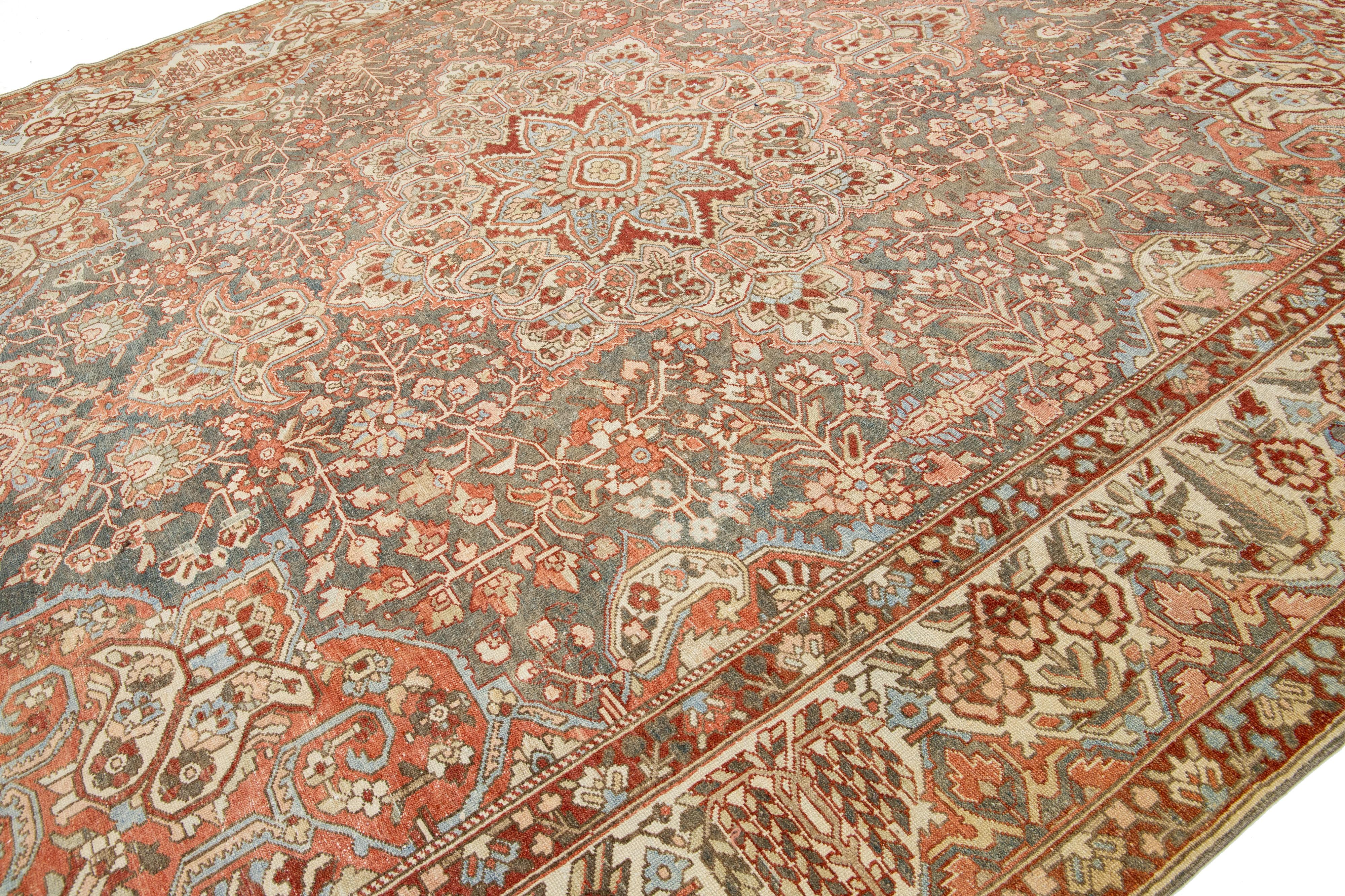 Islamic Peach Persian Medallion Bakhtiari Wool Rug was handcrafted in the 1920s For Sale