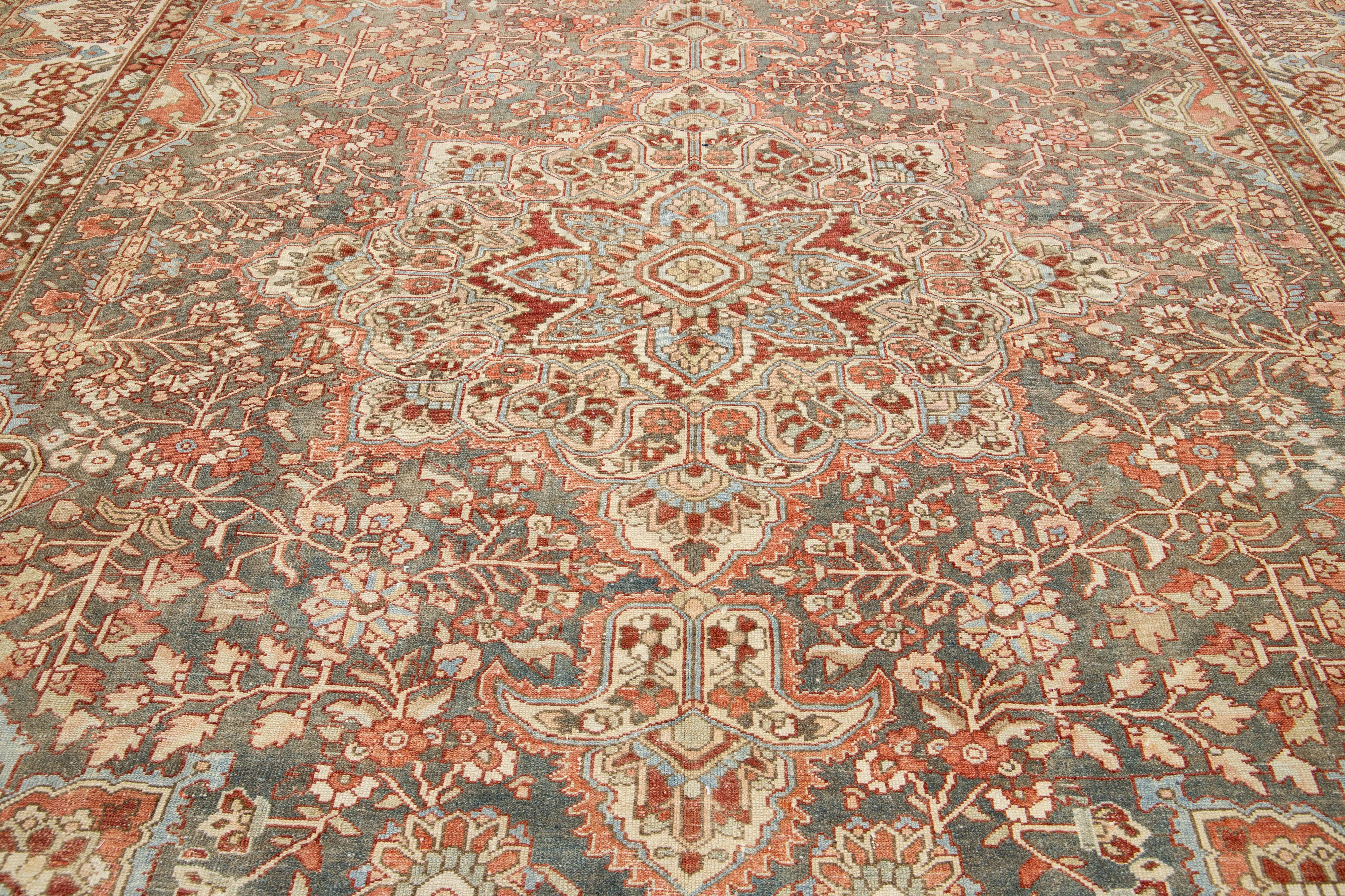 20th Century Peach Persian Medallion Bakhtiari Wool Rug was handcrafted in the 1920s For Sale