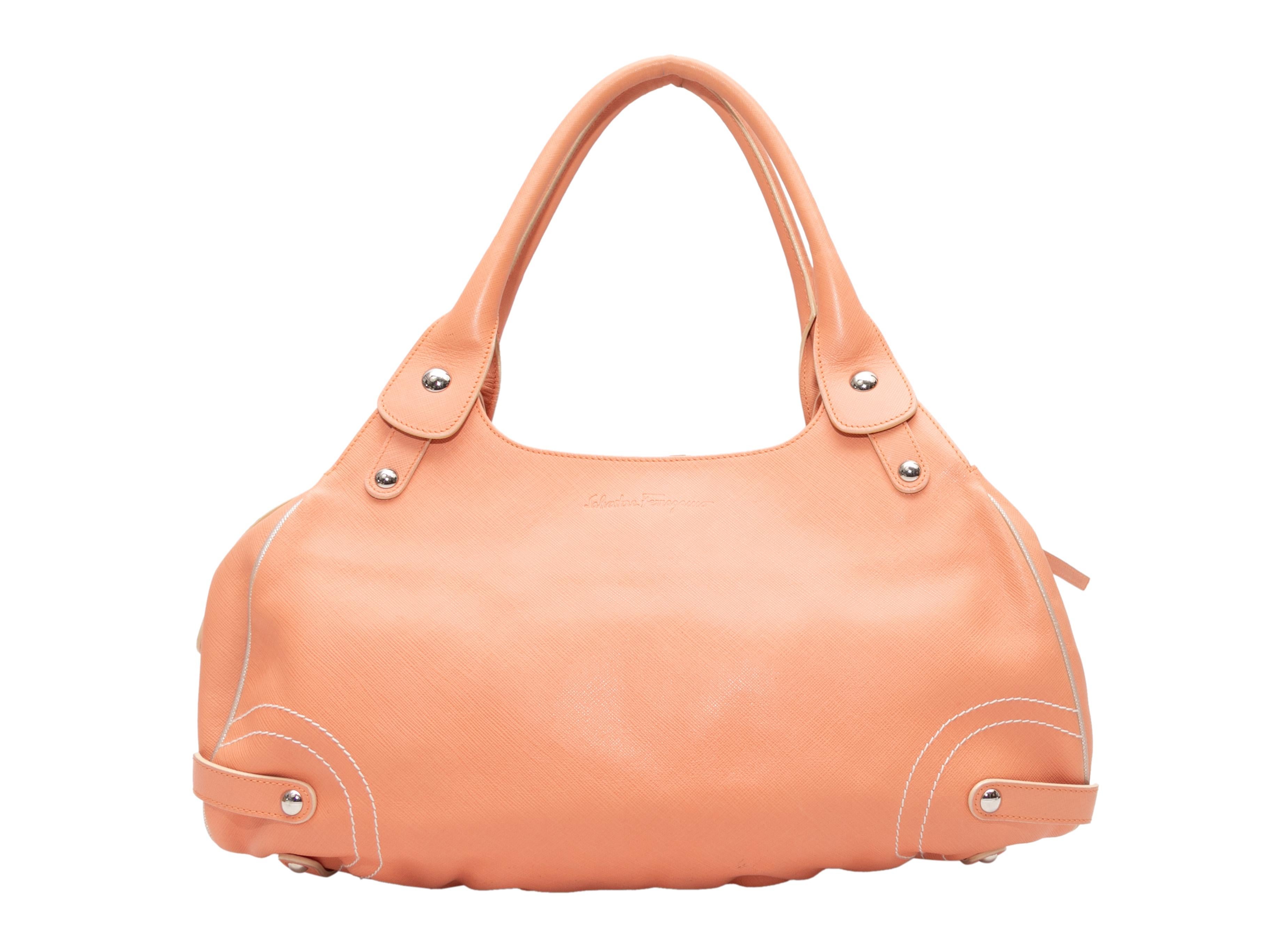 Peach Salvatore Ferragamo Shoulder Bag. This shoulder bag features a leather body, silver-tone hardware, a front Gancini buckle accent, dual rolled top handles, and a top zip closure. 16