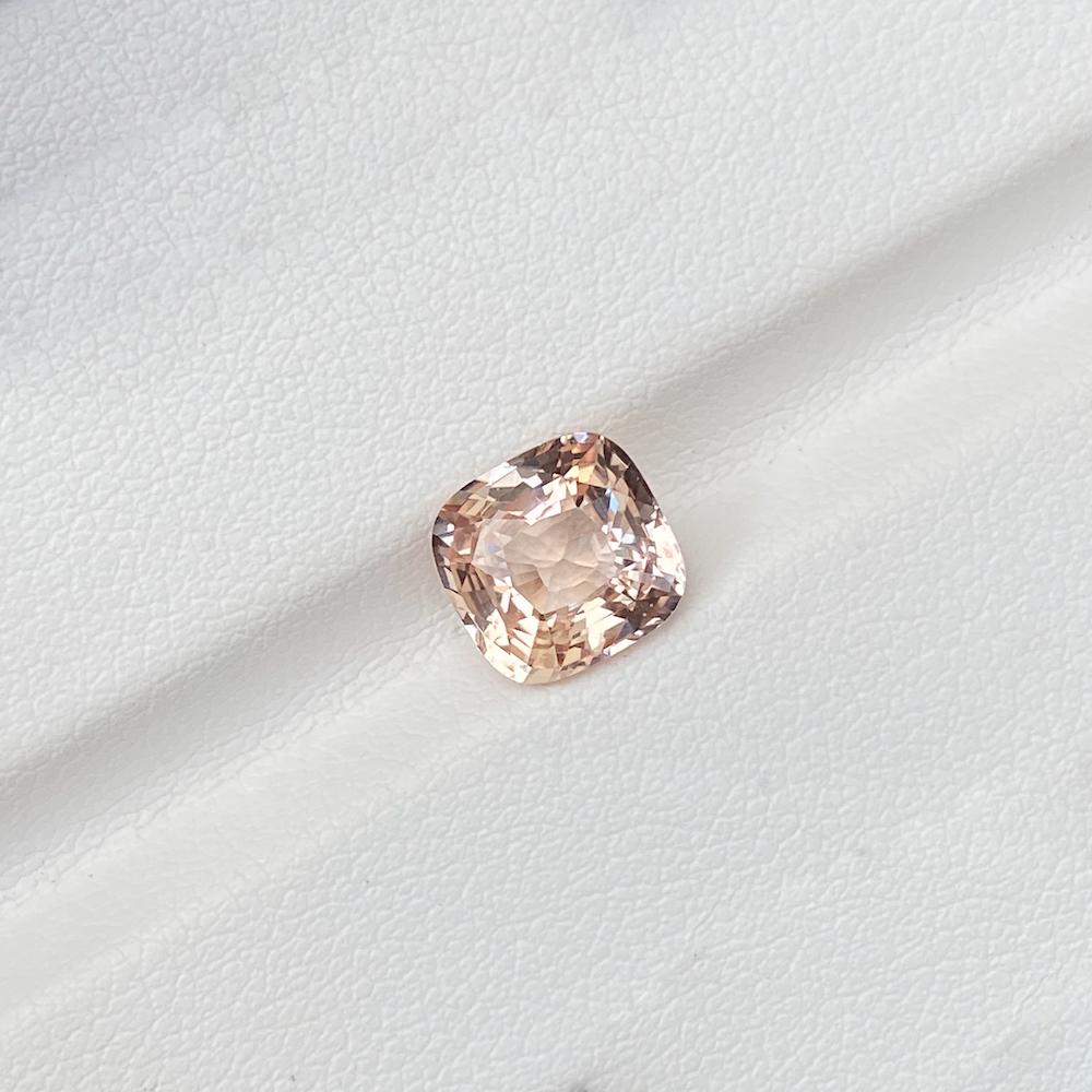 A magnificent large 3 carat certified natural unheated Madagascan peach sapphire skilfully cushion cut to enhance a dreamy peach blush complexion of the softest pinks and yellows. Would make a ravishing delicate jewel for an alternative engagement
