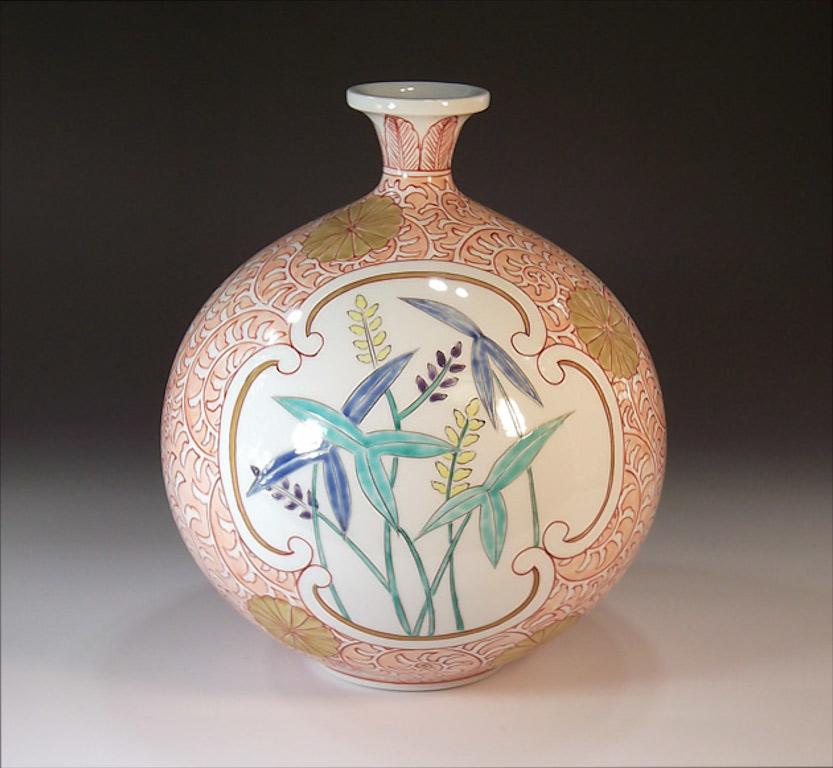 Japanese contemporary gilded decorative porcelain vase, intricately hand painted in vivid peach and white on a stunningly shaped porcelain body, a signed work by highly acclaimed award-winning master porcelain artist from the historic Imari-Arita
