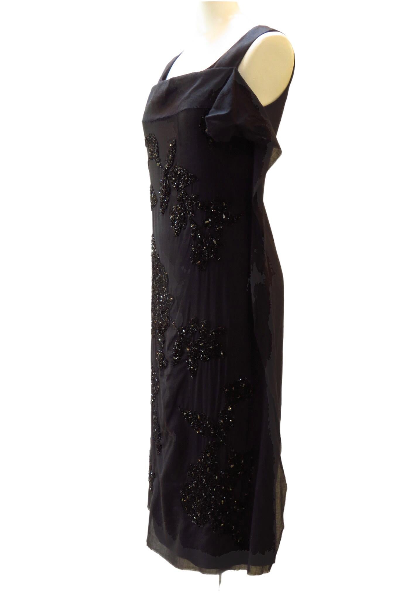 There is no shortage of sequins on this beautiful Peachoo + Krejberg black hand-embroidered dress. Square neckline and back zipper.