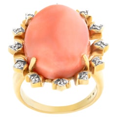 Vintage Peachy Keen coral ring in 18k yellow gold with diamond accent frame