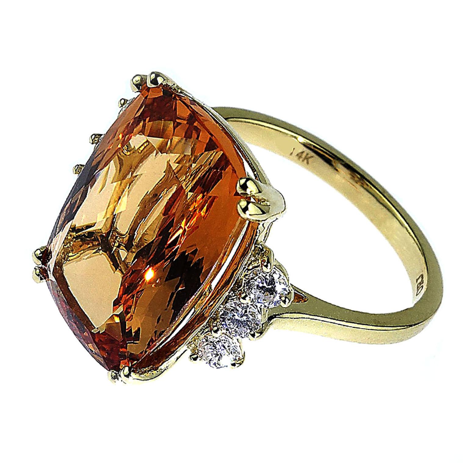 Stunningly beautiful peachy/orange rectangular cushion cut Imperial Topaz with Diamond accents ring.  This gorgeous Brazilian Imperial Topaz of 9.83 carats is accented with .29 carats of sparkling Diamonds.  The handmade 14kt yellow gold mounting is
