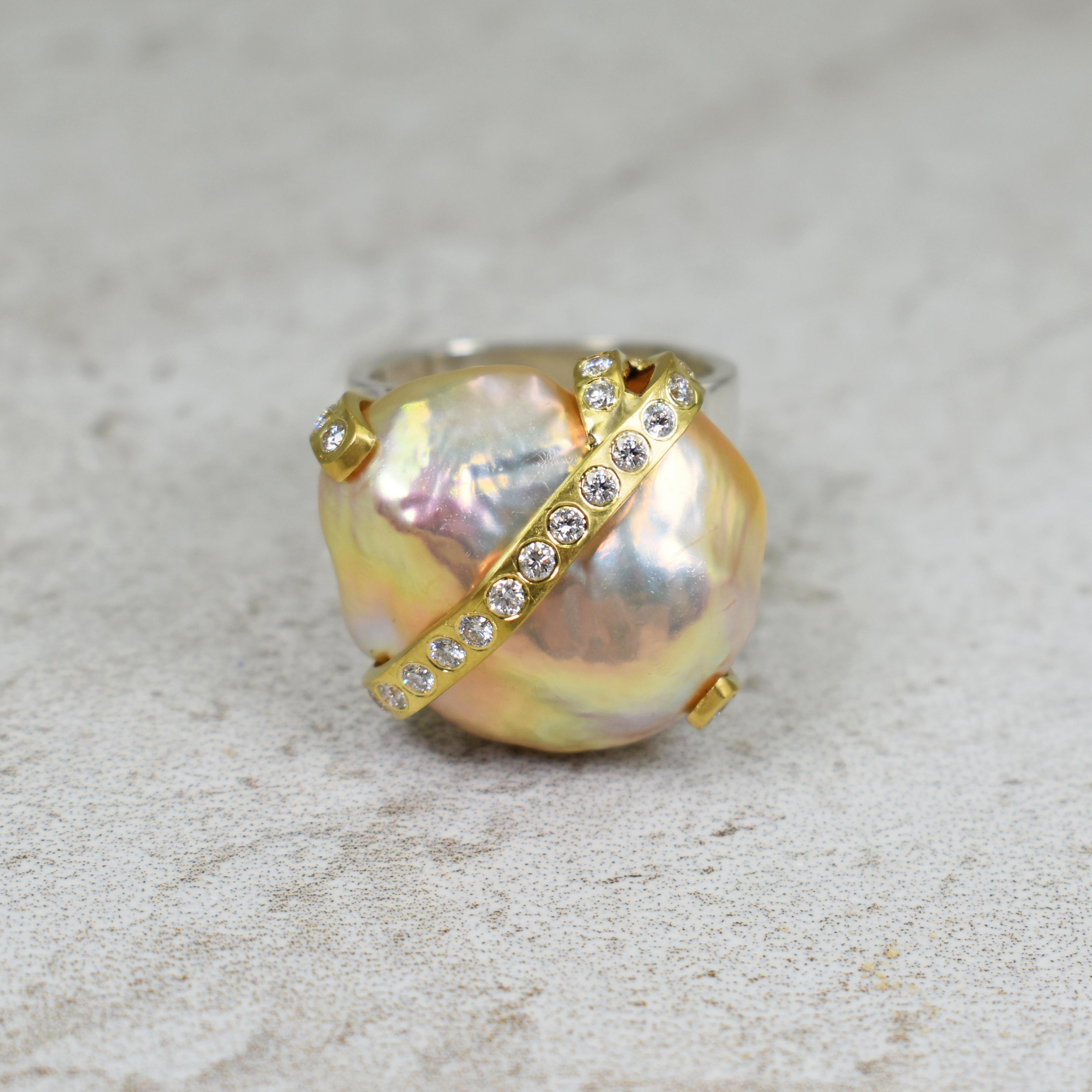 Exceptional peachy pink Freshwater Baroque Pearl set with Diamond and 22k yellow gold ribbon mounted on a signature sterling silver square ring band. Ring size is 6 1/2. The 22k yellow gold ribbon setting has 24 diamonds (0.36 total carat weight,