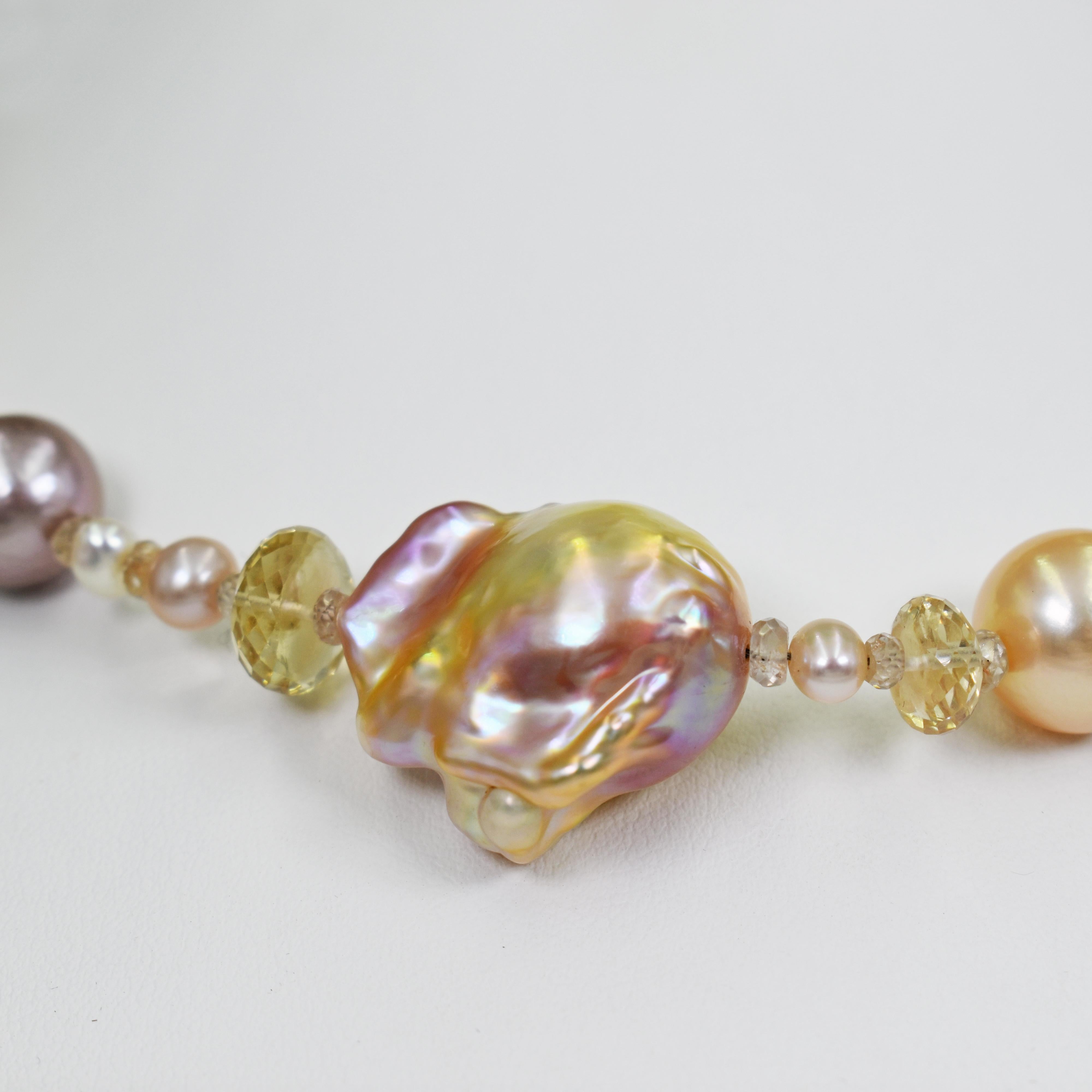 Baroque and round pink, peach and purple color Freshwater Pearls with faceted accent champagne Sunstone beads and finished with a solid 22k yellow gold hook closure. Beaded necklace is 17.5 inches in length. Round pearls range from 4mm to 14mm, and