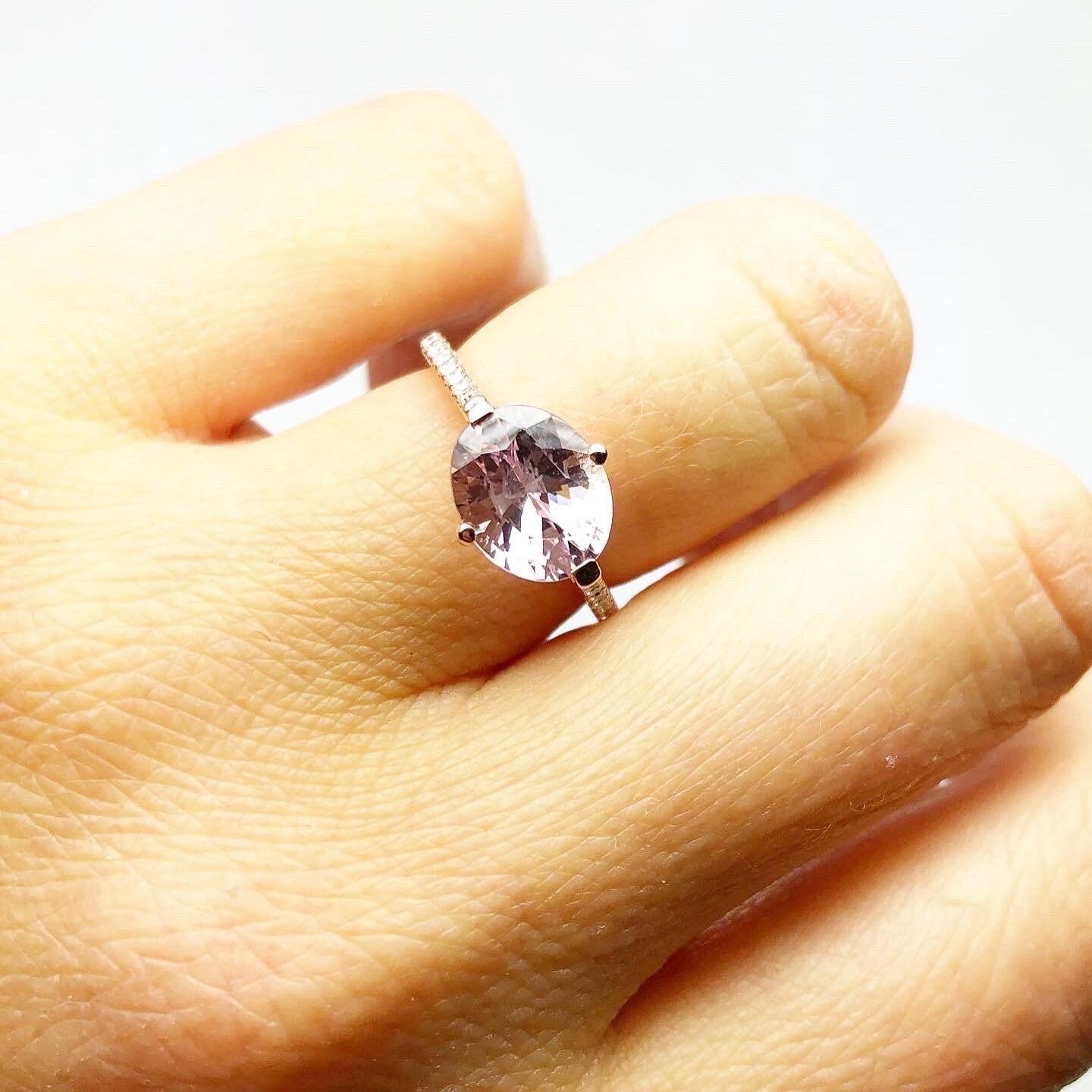 Lovely center sapphire peachy color 2 carats accompanied by VS diamonds on the band made in 18KT rose gold. The ring is so elegant! The ring is a size 6.5 and can be re-sized to any size. Please note natural peachy sapphires in such a large size are