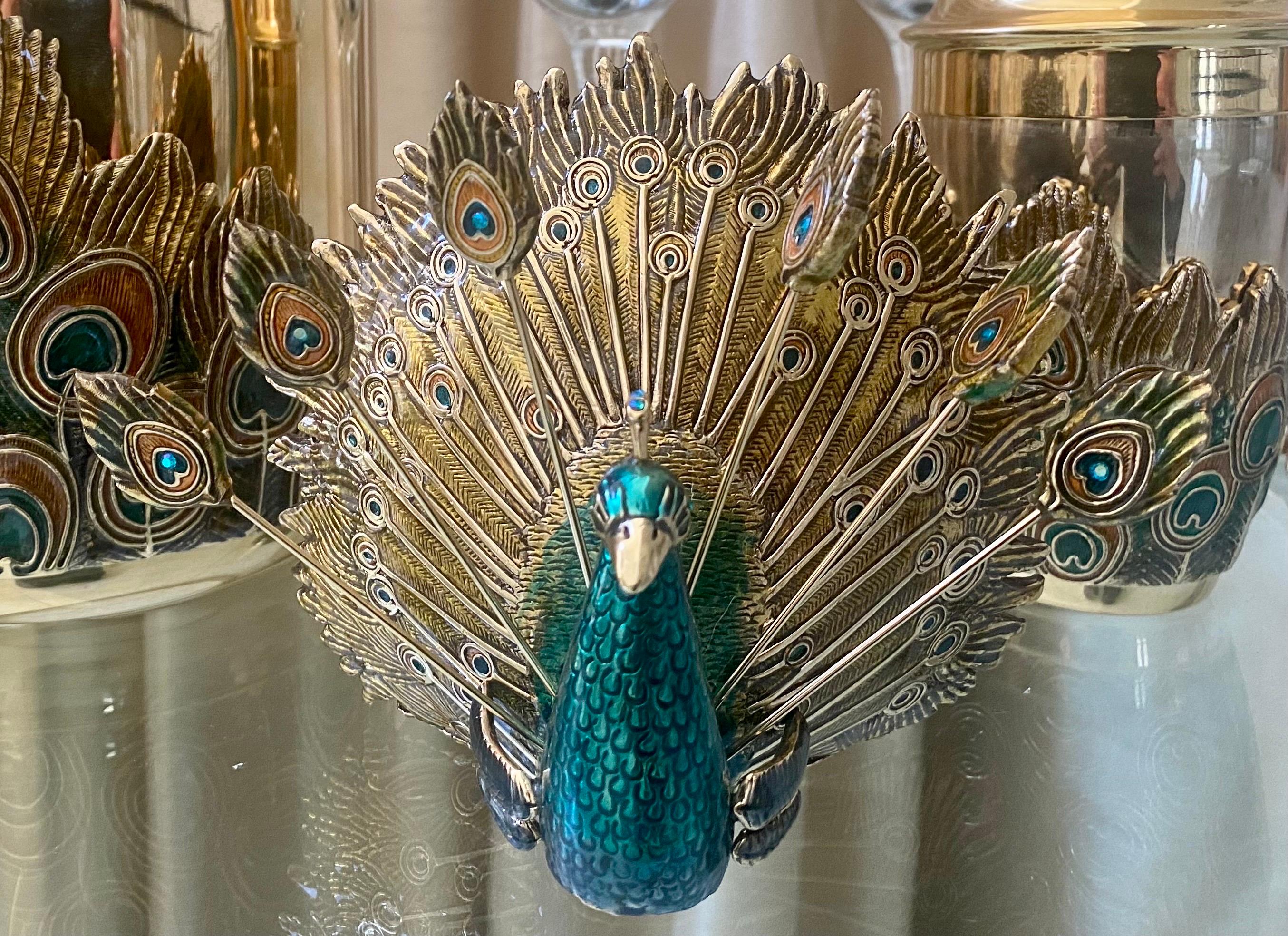 A gorgeous 8 piece set from St. John Home, a limited production. The set consists of 5 martini glasses, measuring 4.25 inches in diameter and stand 7 inches tall, a peacock stand, with 6 olive pins, which holds cocktail napkins, measuring 5 inches