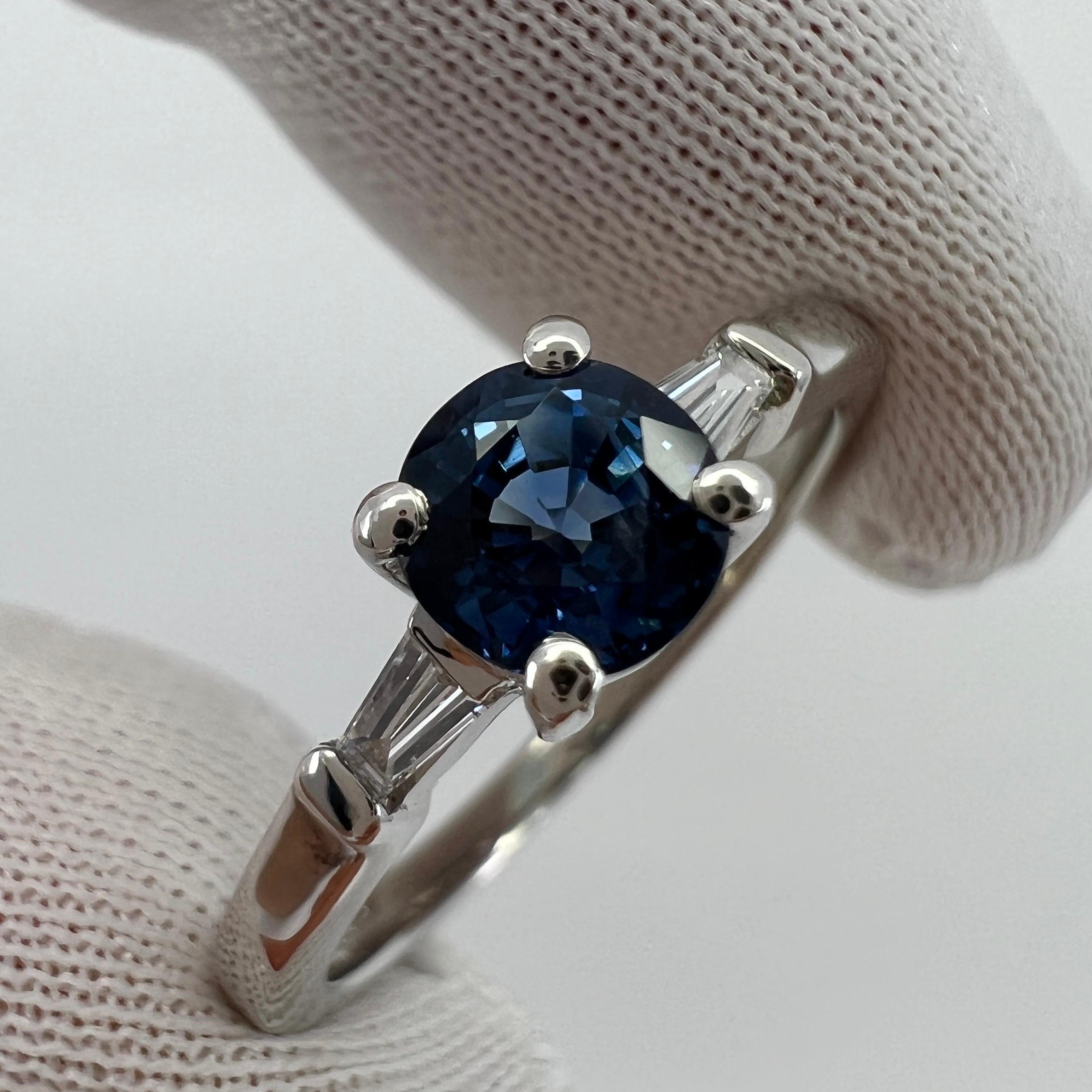 Peacock Blue Sapphire & Tapered Baguette Diamond 18k White Gold Three Stone Ring.

Fine 0.71 Carat sapphire with a stunning vivid 'peacock' blue colour and excellent clarity. Very clean stone.
Also has an excellent round brilliant cut which shows
