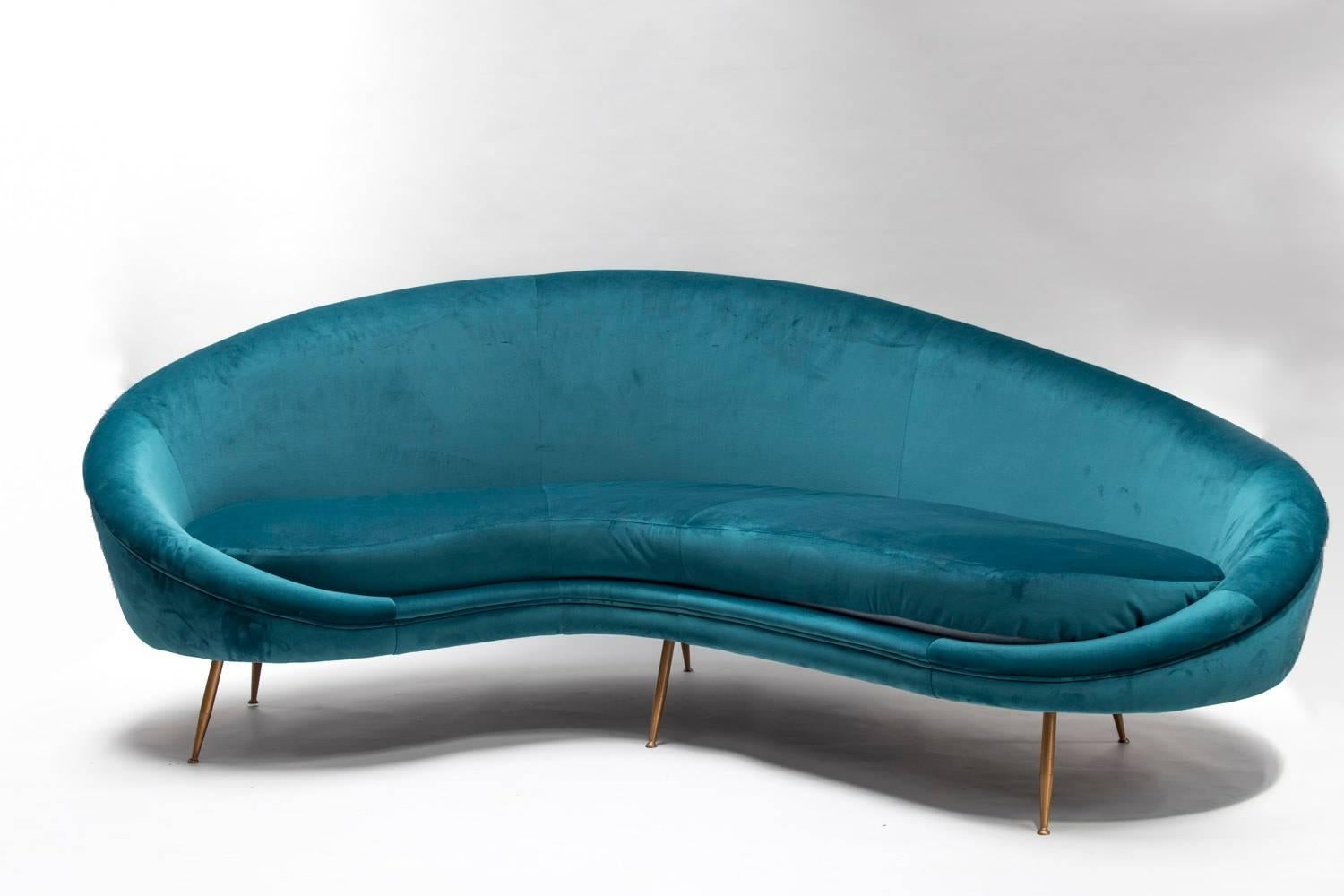 Peacock blue velvet sofa in the style of the 1950s.
Nice curved 