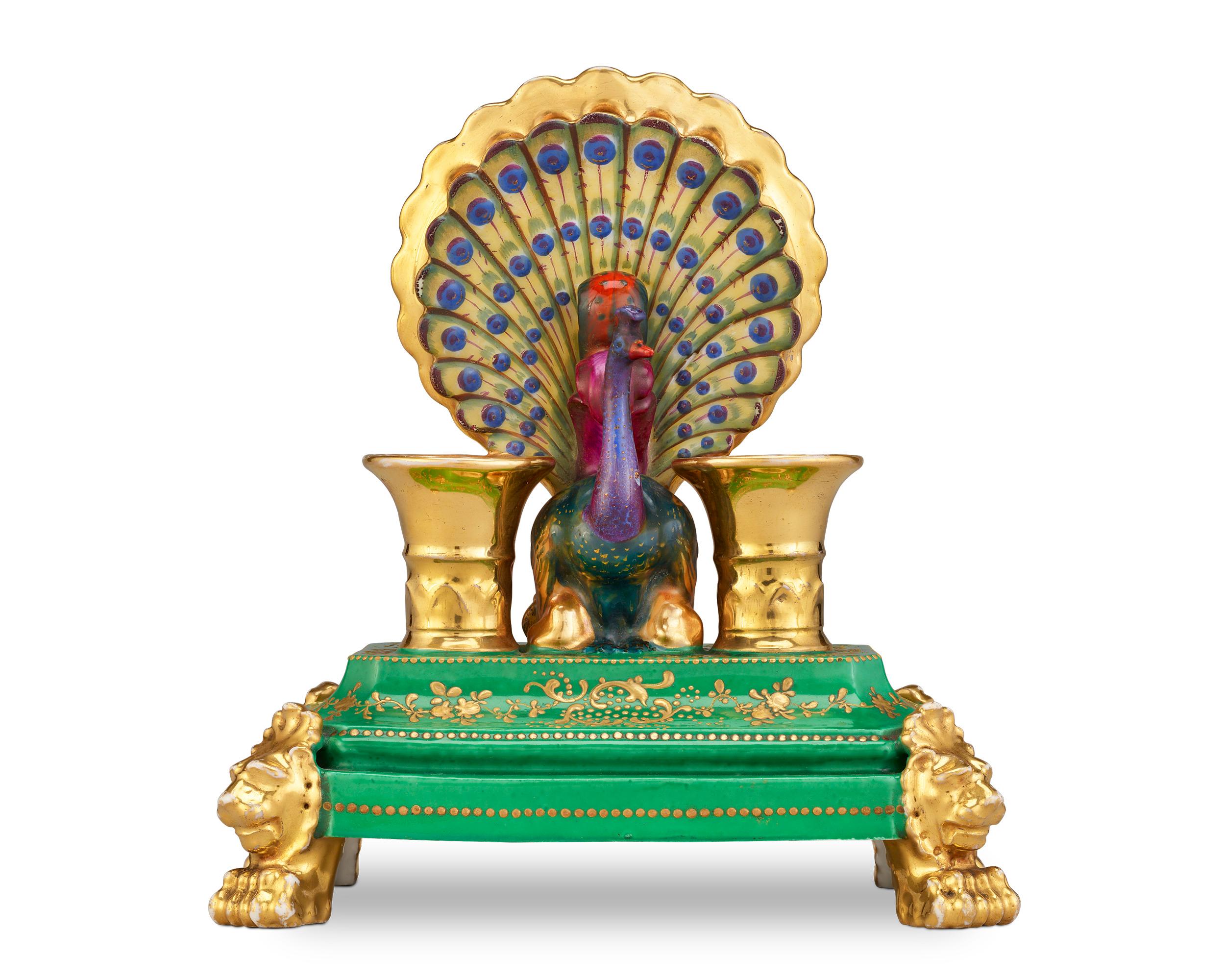 This candle holder by renowned porcelain manufacturer Jacob Petit is extravagantly designed in the form of a majestic peacock. Petit owned one of the most important and well-known porcelain factories in France, becoming one of the major producers of