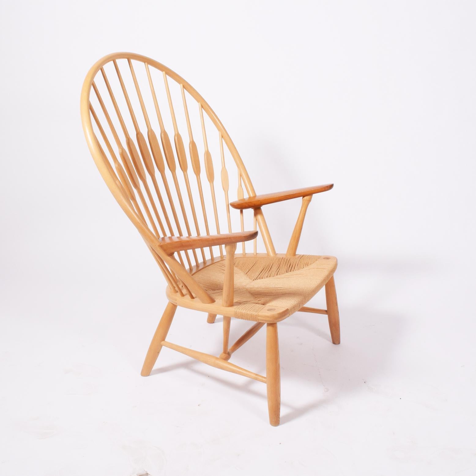 Solid ash back frame and spindles, solid teak arms on Danish woven papercord seat. Solid tapering legs. Marked on frame with manufacturer's mark. Made by Johannes Hansen. Designed 1947, this example, circa 1970s.