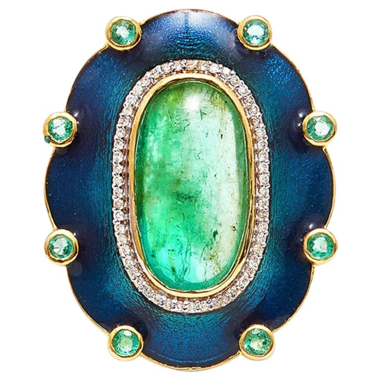 Preen like a Peacock in our fabulous Emerald enamel Diamond Cocktail Ring featuring a Columbian Emerald in a glossy teal enamel setting accented with sparkling White Diamonds.  

- Natural Cabochon Colombian Emeralds weight 10.18 Carats.
- White