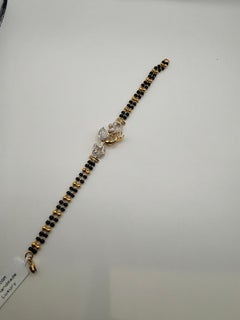 Peacock diamond bracelet onyx, ruby and diamonds 18KT gold bead bracelet