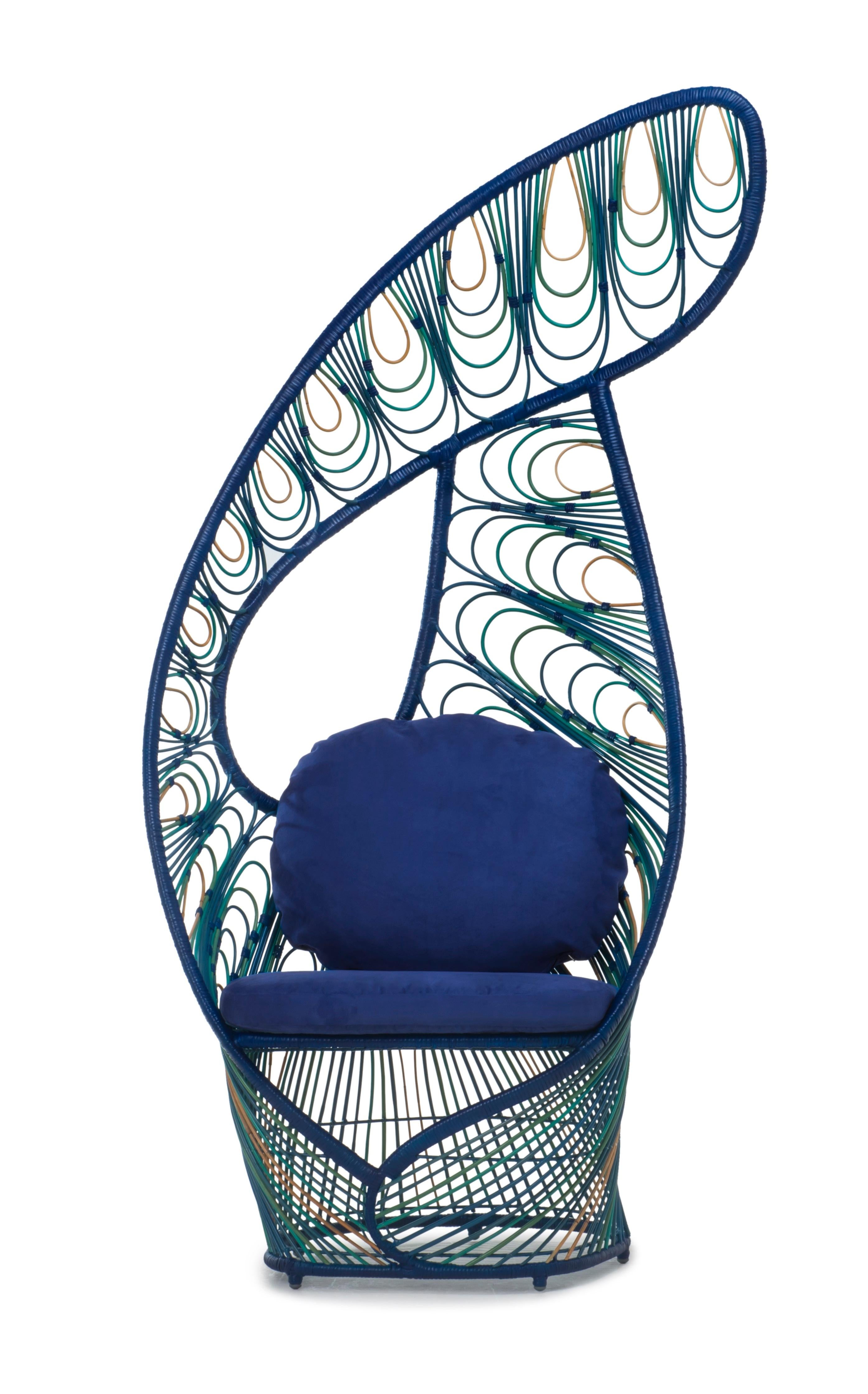 Peacock Easy armchair by Kenneth Cobonpue.
Materials: Rattan
Also available in other colors.
Dimensions: 68.5 cm x 90 cm x h 198 cm 

Peacock is a modern take on the traditional wicker chair of the same name. Like the regal bird, this lounge
