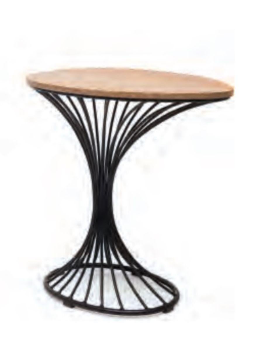 Peacock end table by Kenneth Cobonpue.
Materials: beech, steel. 
Dimensions: 33 cm x 50 cm x H 50.5 cm 

Peacock is a modern take on the traditional wicker chair of the same name. Like the regal bird, this lounge chair truly stands out among the