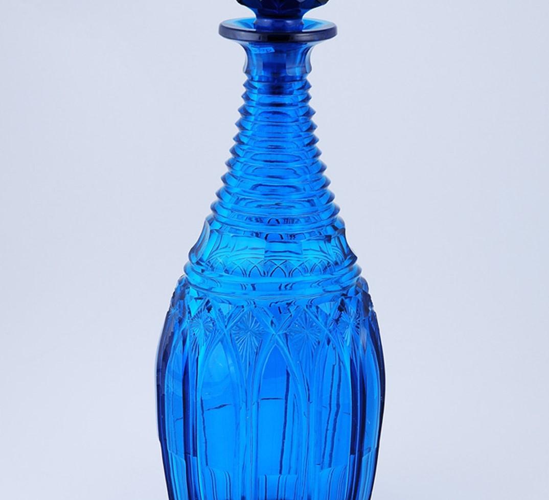 Peacock green cut-glass decanter
English, circa 1840.
Glass, blown and cut.
Measures: 13 1/2 in. high.

Condition: Perfect, except for minor flakes on the bottom of stopper.
  

