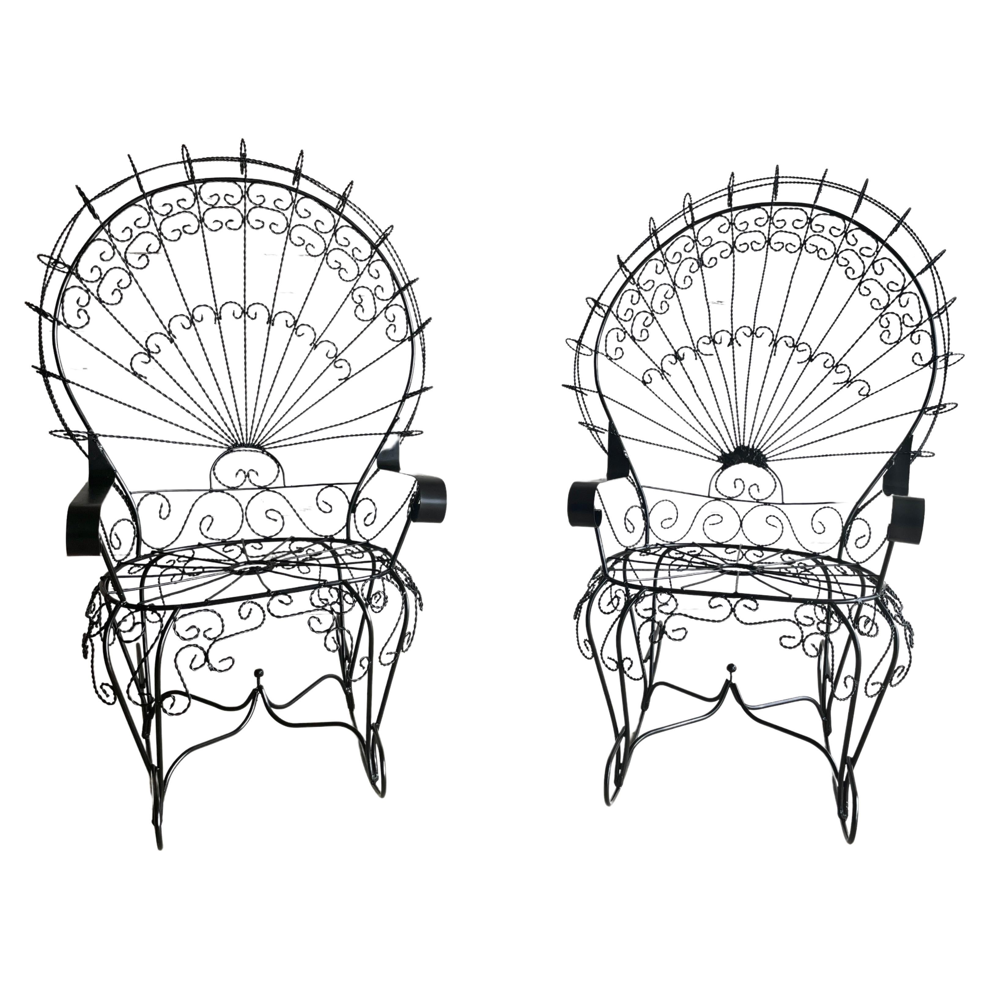 Iron peacock rocking patio chairs in the style of Salterini with new powder coating in satin black.