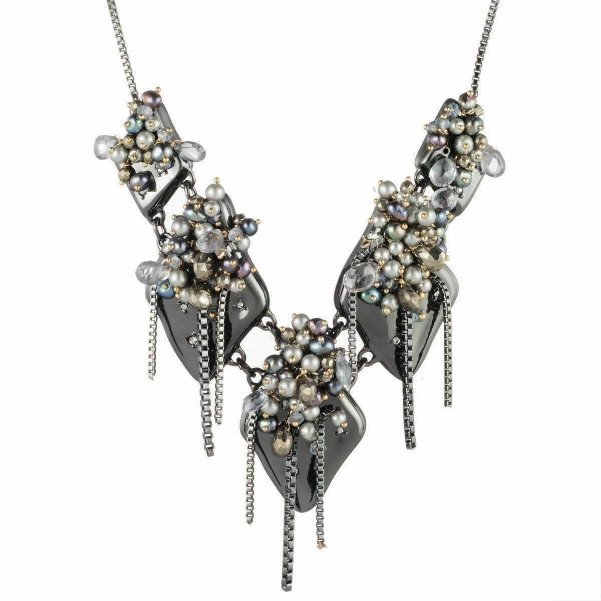 Simply Beautiful! Chic and Stylish Five-station Necklace adorned with Freshwater Peacock Pearl clusters • semi-precious Beads • Pyrite • Quartz • Swarovski Crystals • Gunmetal make up this Fabulous Designer Necklace by Alexis Bittar. Crafted in