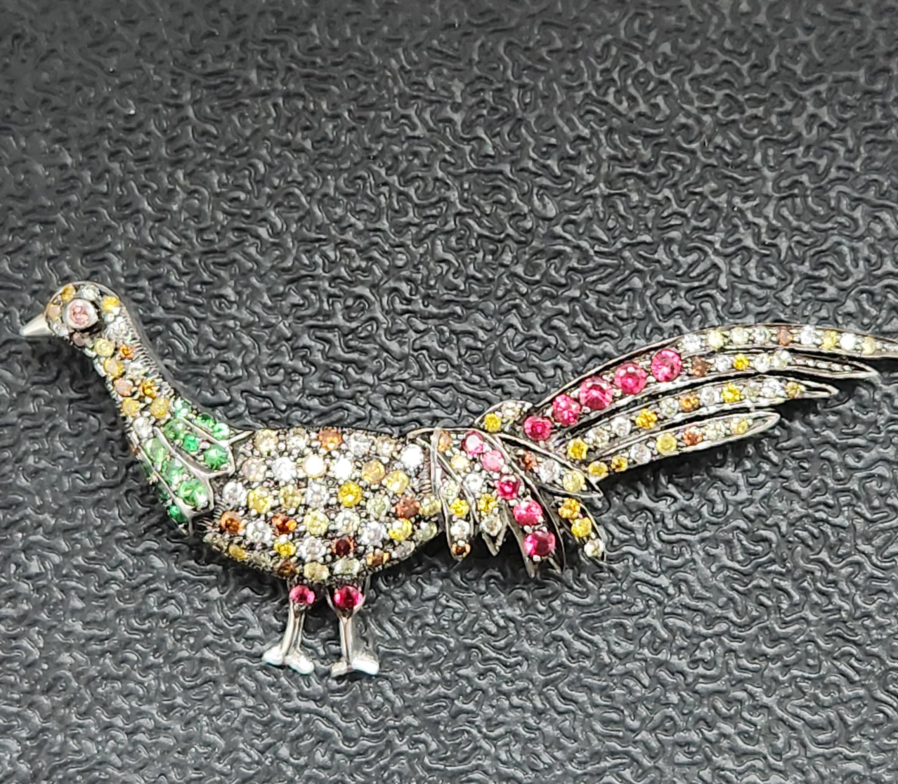 Introducing the Peacock shaped Fancy colored Brooch, a stunning piece of jewelry that captures the beauty and grace of a peacock in a unique and stylish way. The centerpiece of this piece is an intricate and detailed peacock design that is adorned