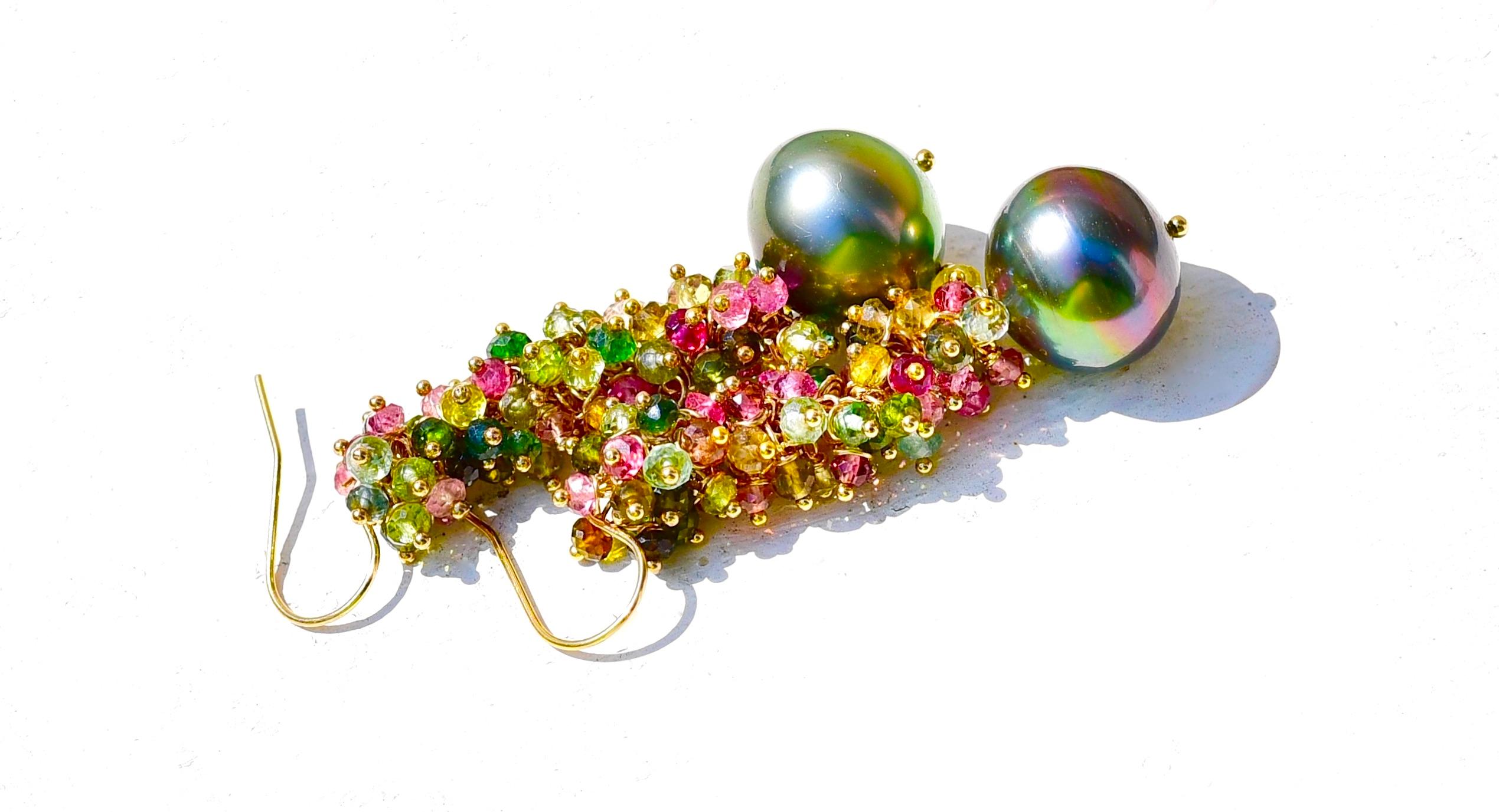Strong and bold peacock Tahitian south sea pearl (13mm x 14,2mm) has been topped with multi-colored tourmalines. These earrings would be gorgeous in the Fall and Winter seasons when the weather is colorful and crisp. Rich look for special days!