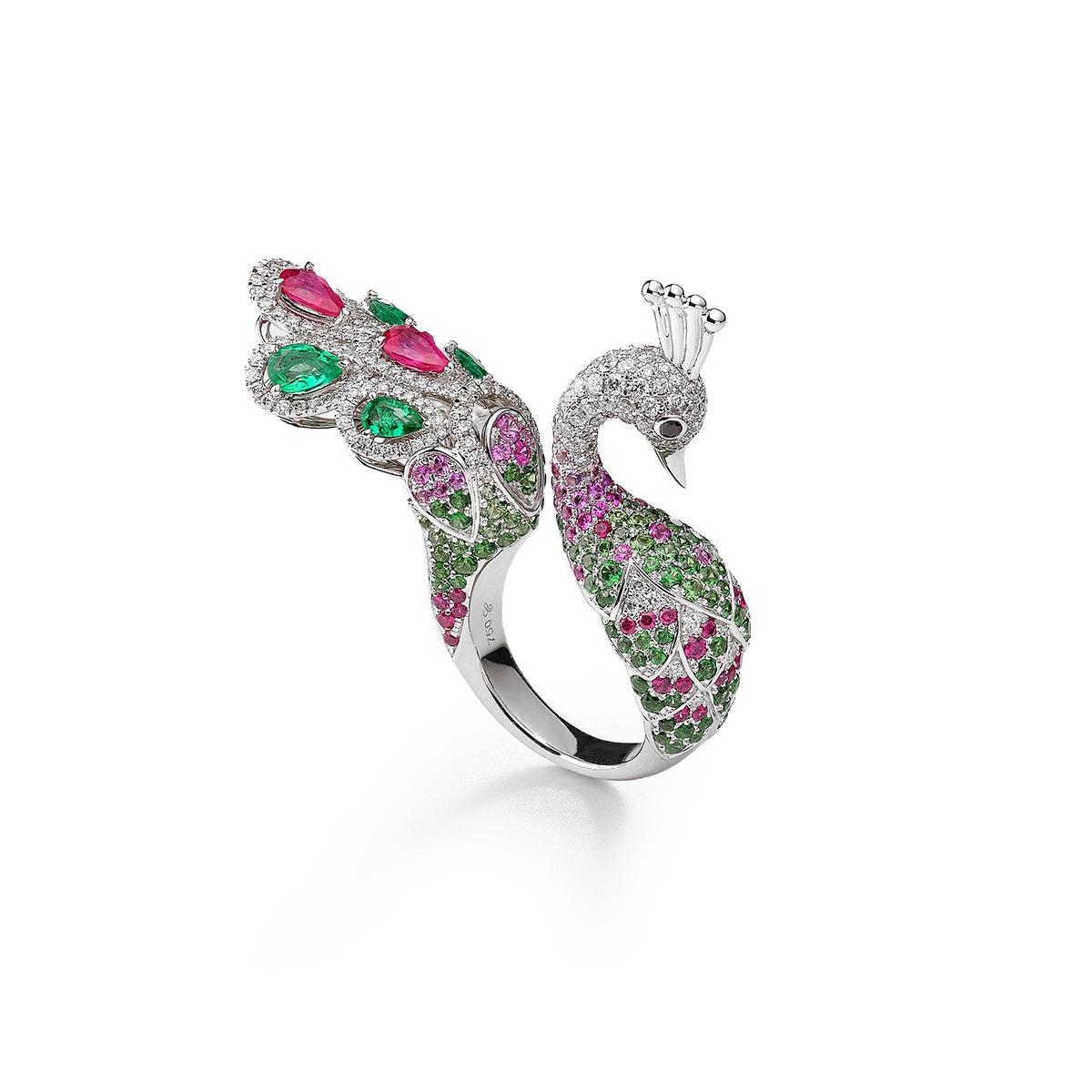 Peacok ring in 18kt white gold set with 234 diamonds 1.61 cts, 4 pear-shaped  cut emeralds 0.99 cts , 2 pear-shaped cut rubies 0.89 cts, 56 pink sapphires 0.90 cts,  31 rubies 0.47 cts, 116 tzavorites 1.95 cts and 2 black diamonds 0.04 cts  Size 55 