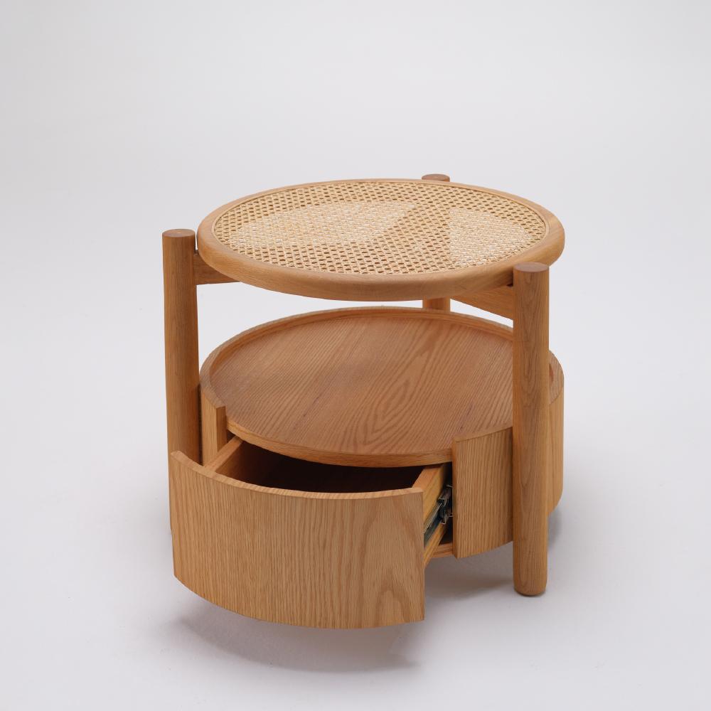 Meet the Peak family’s Peak Nightstand. With its rounded structure and aesthetic look, it will become an indispensable part of your bedside. Highly functional with its hidden drawer and cane shelf.