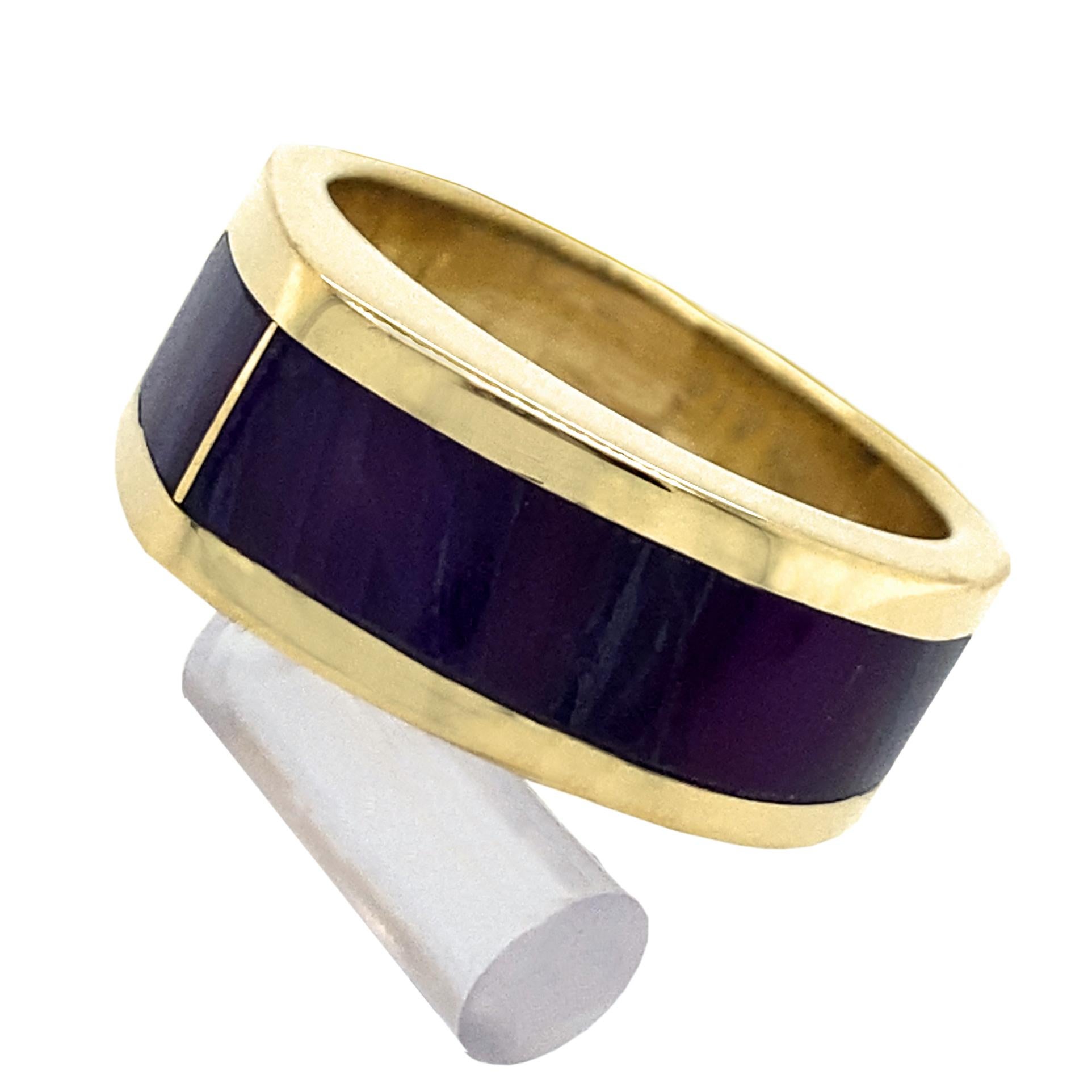 Eytan Brandes created this sleek design years ago to be channel-set with diamond baguettes.  Recently, however, he rediscovered an old sugilite mineral sample among his many drawers of Interesting Jeweler Stuff and thought it would look great as the