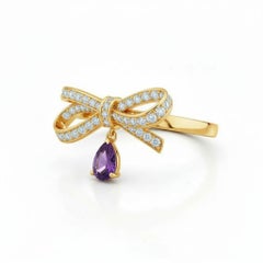 Pear amethyst drop bow ring in 14k gold