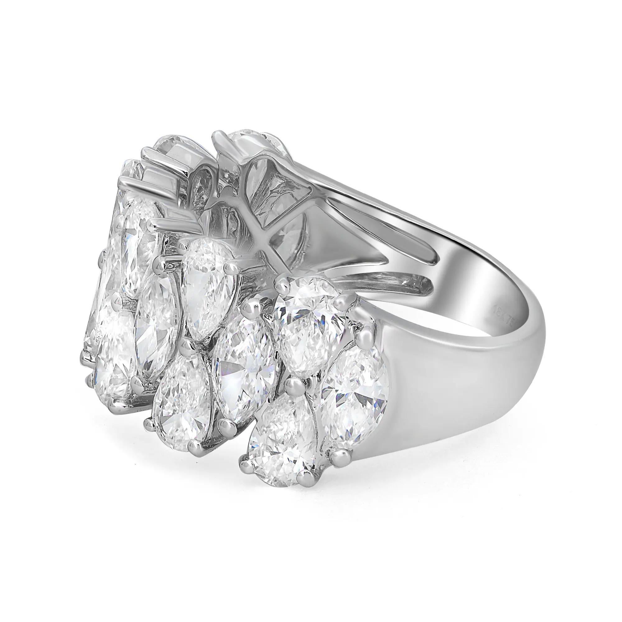 Shimmering and elegant, this statement diamond band ring is crafted in lustrous 18K white gold and features 19 prong set dazzling pear and marquise cut diamonds weighing 3.93 carats. Diamond quality: I-J and clarity VS. Perfect to flaunt with any
