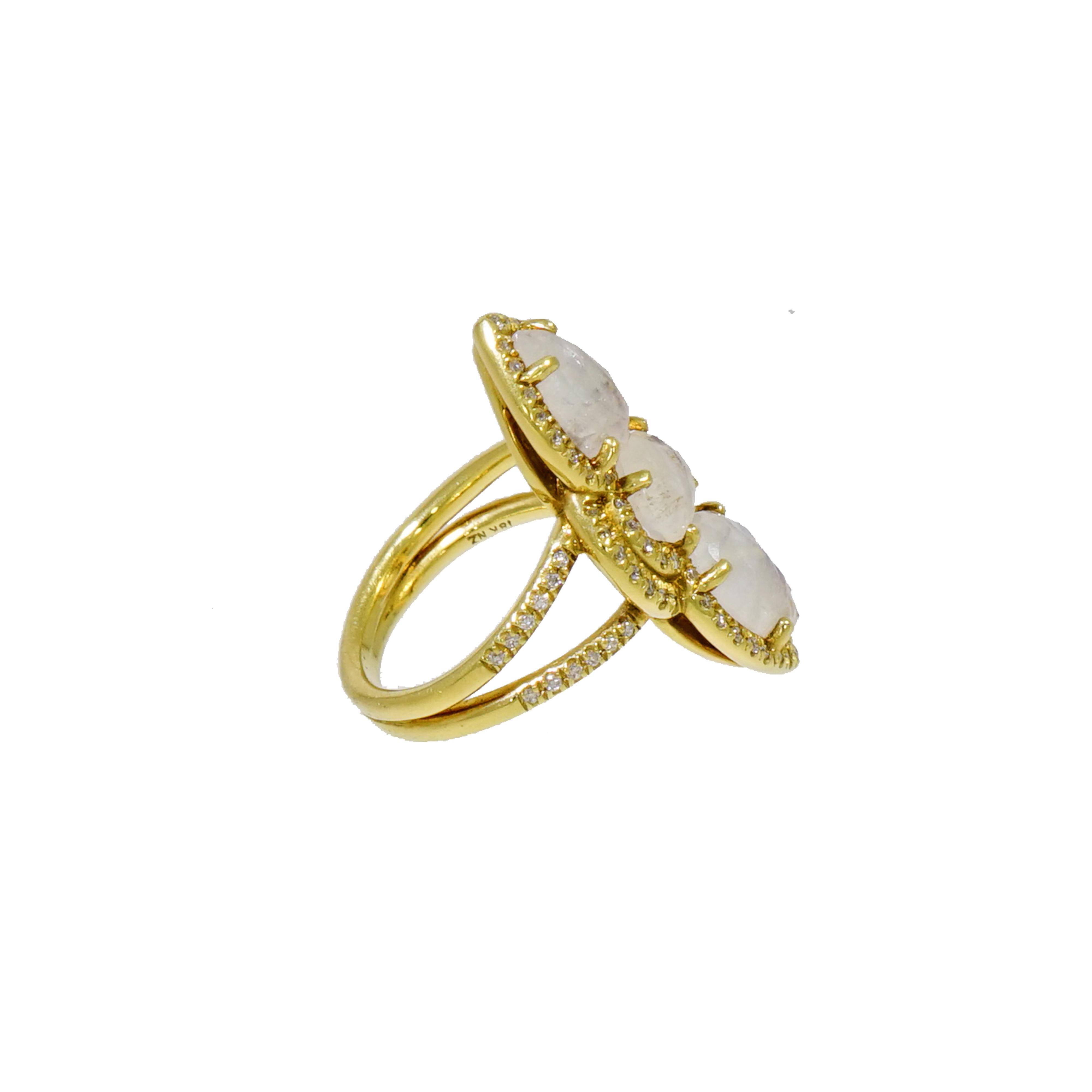From the lower key to the extravagant...This Moonstone Ring is so much more: a dreamy bundle of Moonstone and Diamonds. Designed and crafted in NYC in 18k yellow gold with faceted pear and oval shaped moonstones displaying colors and illuminated by