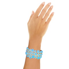 Bracelet contemporain en or jaune avec turquoises, émeraudes et diamants