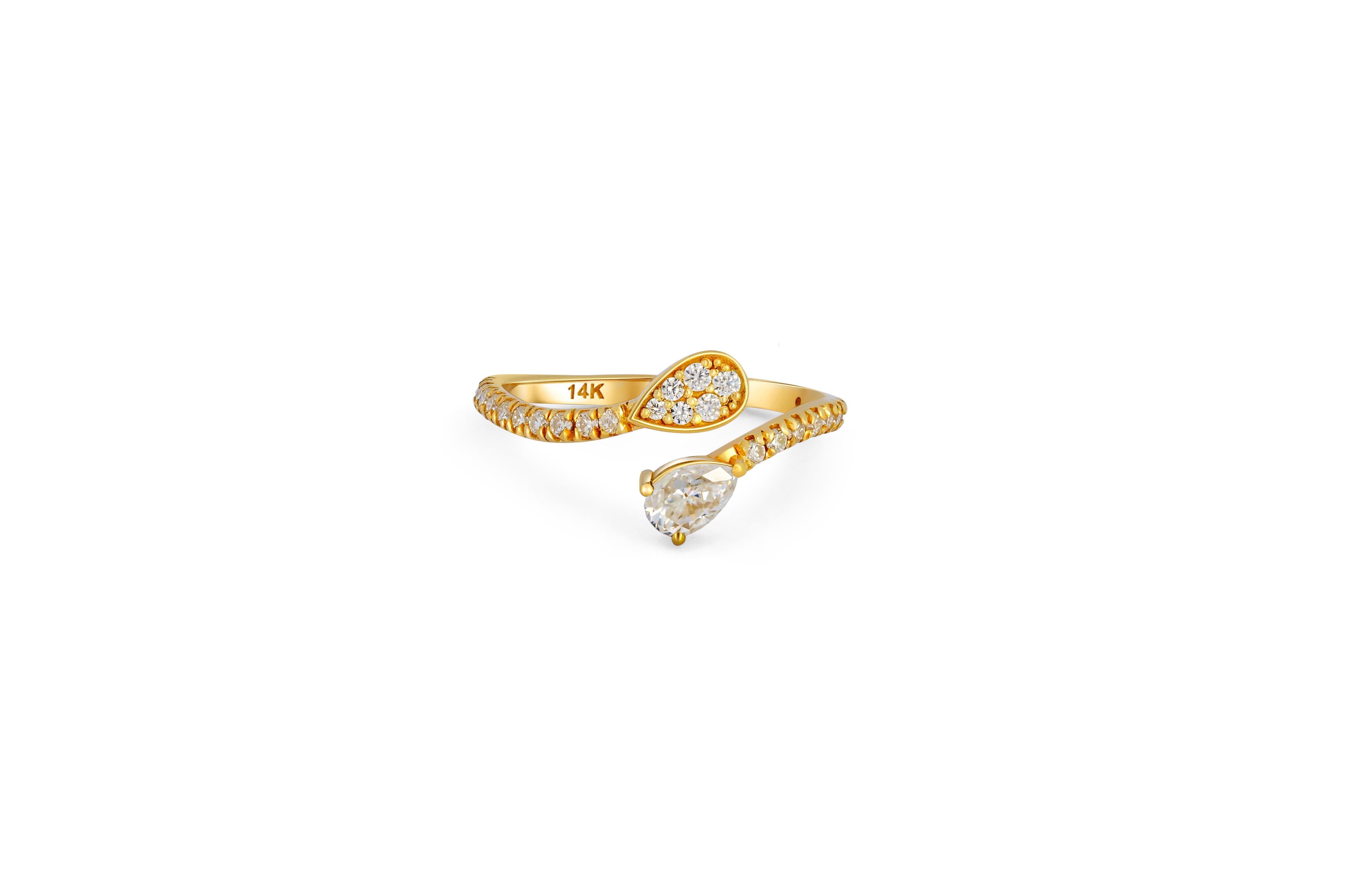 For Sale:  Pear and round diamond cut moissanite open ended 14k gold ring.  3