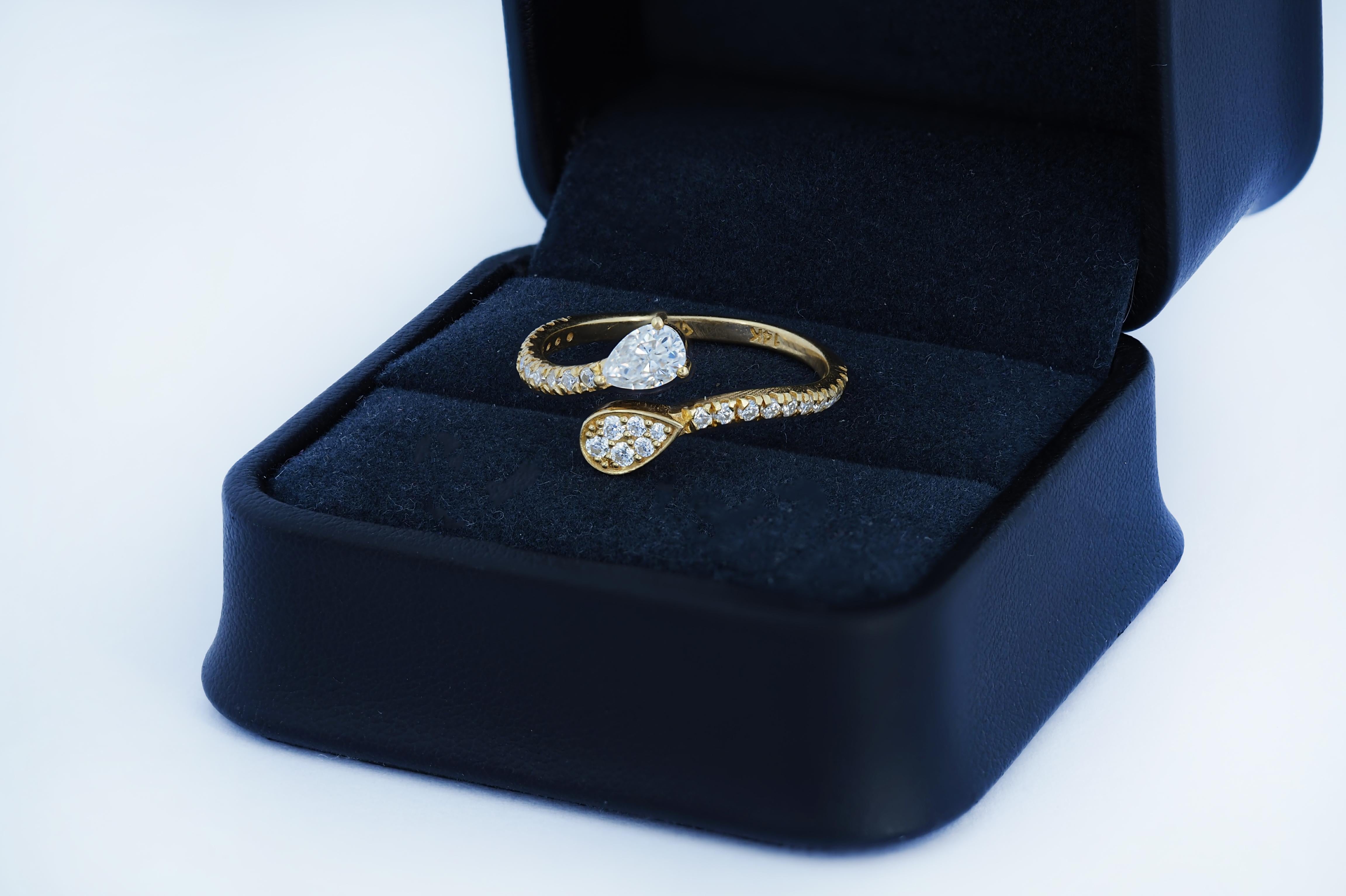 For Sale:  Pear and round diamond cut moissanite open ended 14k gold ring 5
